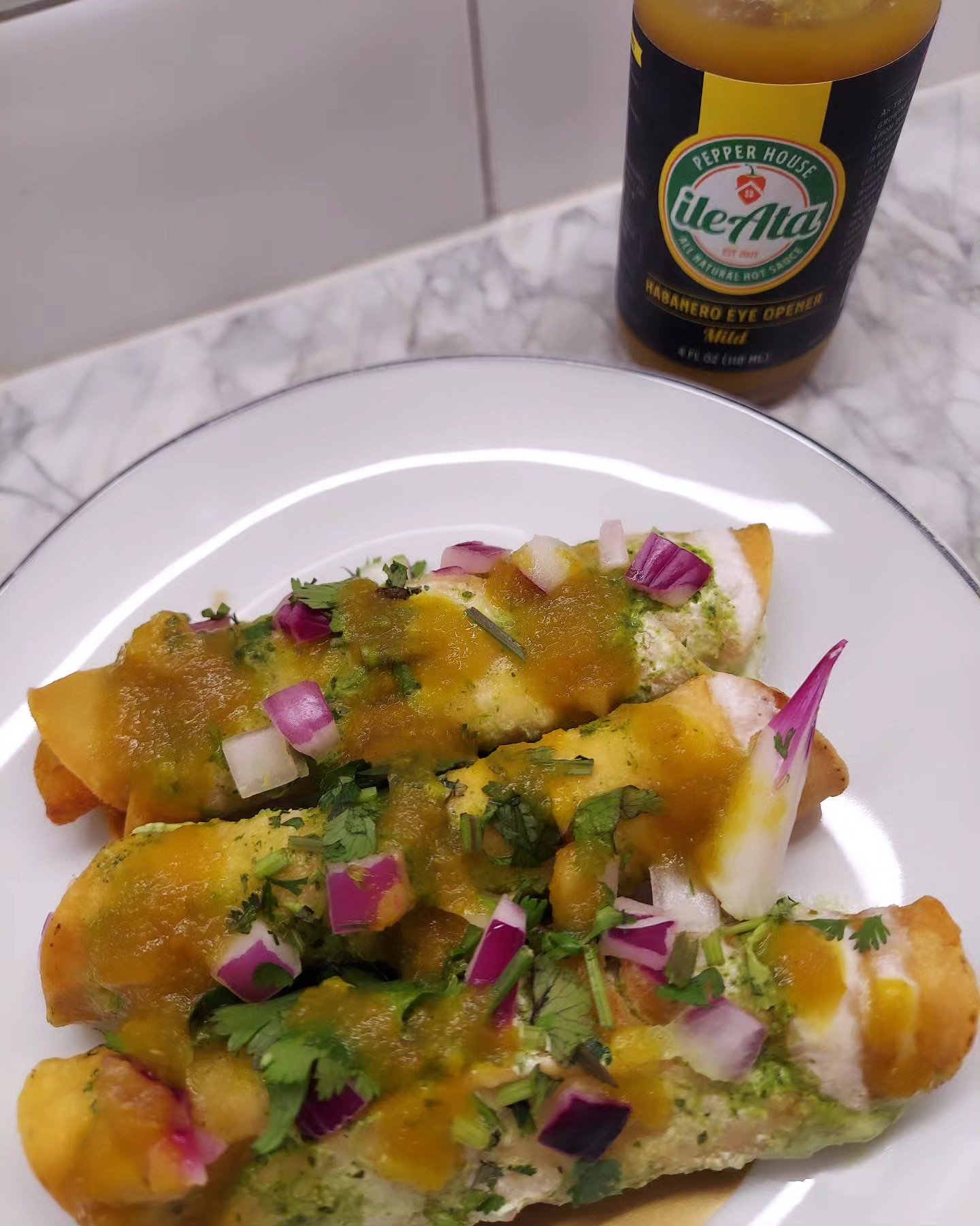 A healthy dash of yellow hot sauce spices up your tostadas 🔥 Try our Habanero Eye Opener Mild yellow sauce #HotSauce #HotSauceForSale #IleAtaHotSauce #IleAtaPepperHouse #IleAta #Tostadas #YellowSauce #YellowHotSauce #MildSauce #MildHotSauce