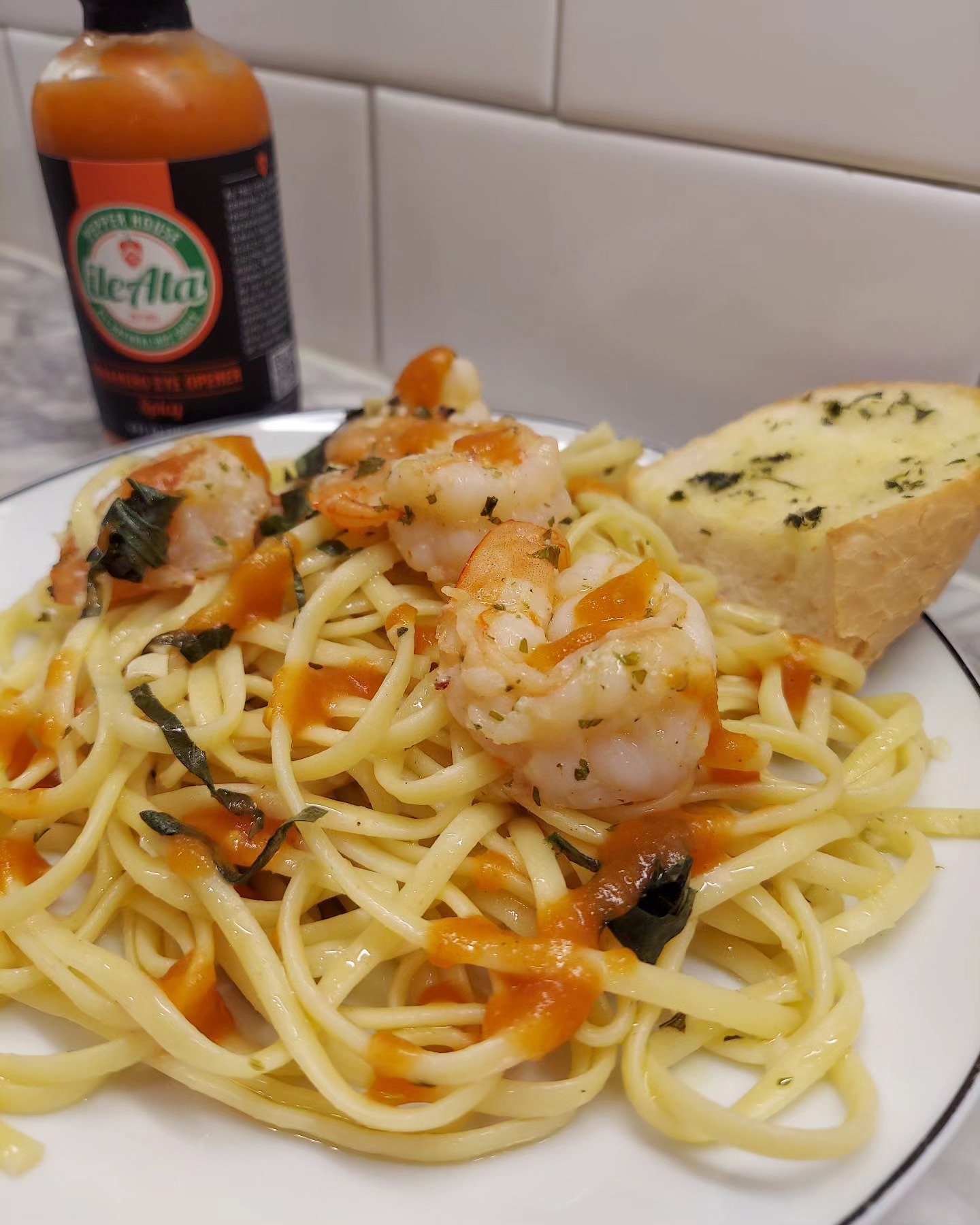 Shrimp linguine paired with spicy orange habanero hot sauce tastes incredible #HabaneroHotSauce #HabaneroEyeOpener #Spicy #SpicyHotSauce #HotSauce #HotSauceOnEverything #Shrimp #ShrimpLinguine