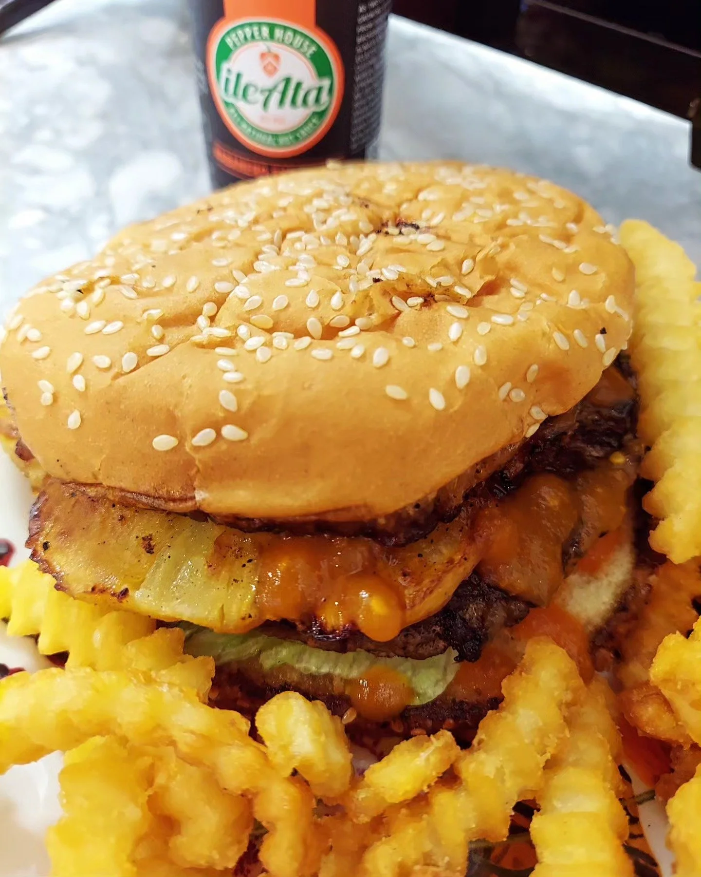 Add a blast of spice and flavor to your burger with our orange Habanero Eye Opener Spicy sauce. The hottest sauce in our lineup! #HotSauce #Spicy #Flavor #Burger #CheeseBurger #Hamburger #Fries #FrenchFries #OrangeHotSauce #Pineapple #PineappleOnBurg