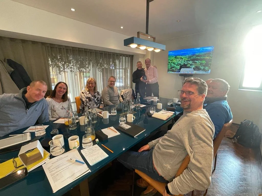 Progressive Leaders group members around a boardroom table