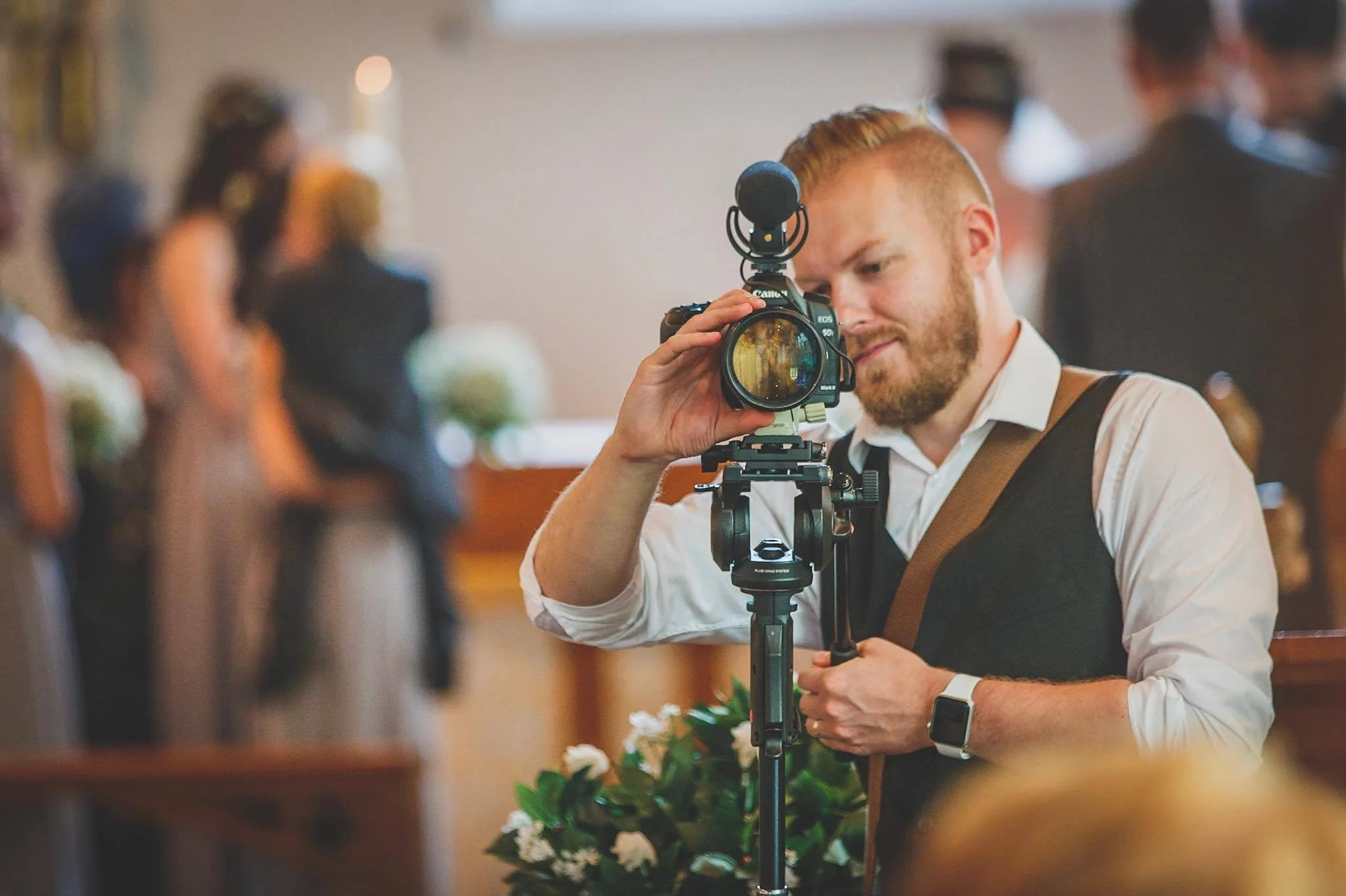Sam of Tick Tock Films filming a wedding
