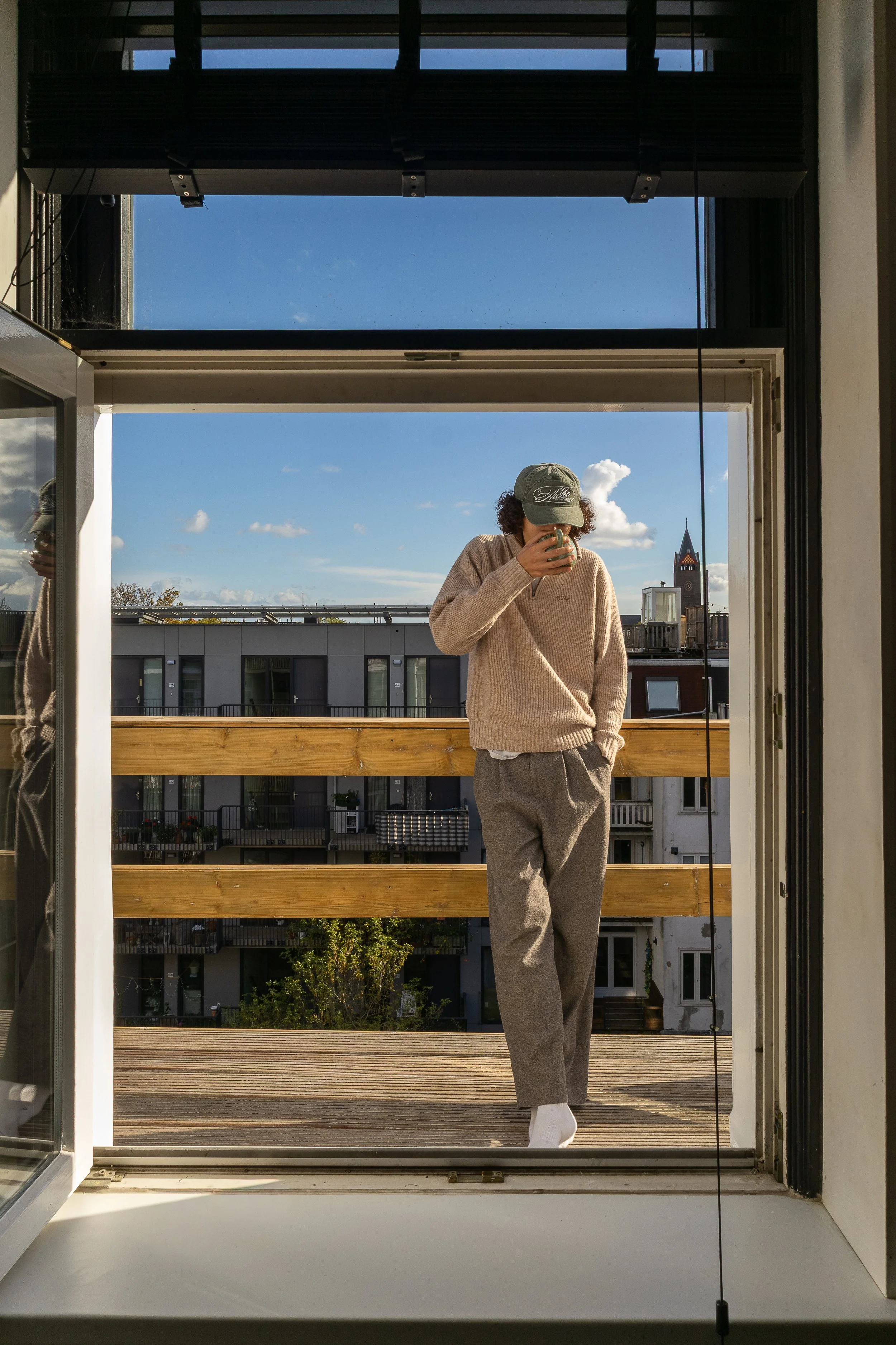 John-Lewis on his balcony