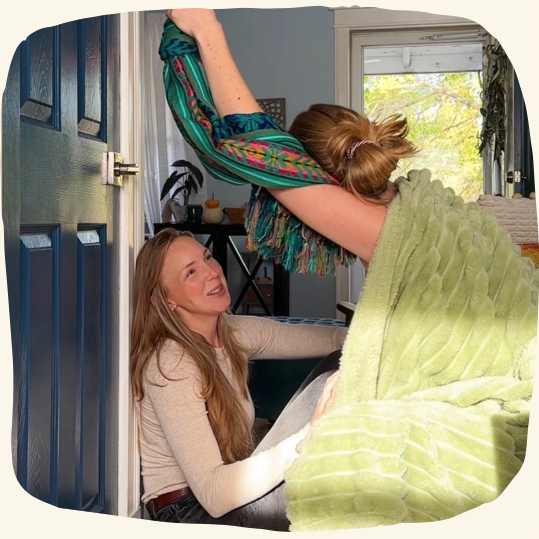 Doula supporting mom through labor with rebozo