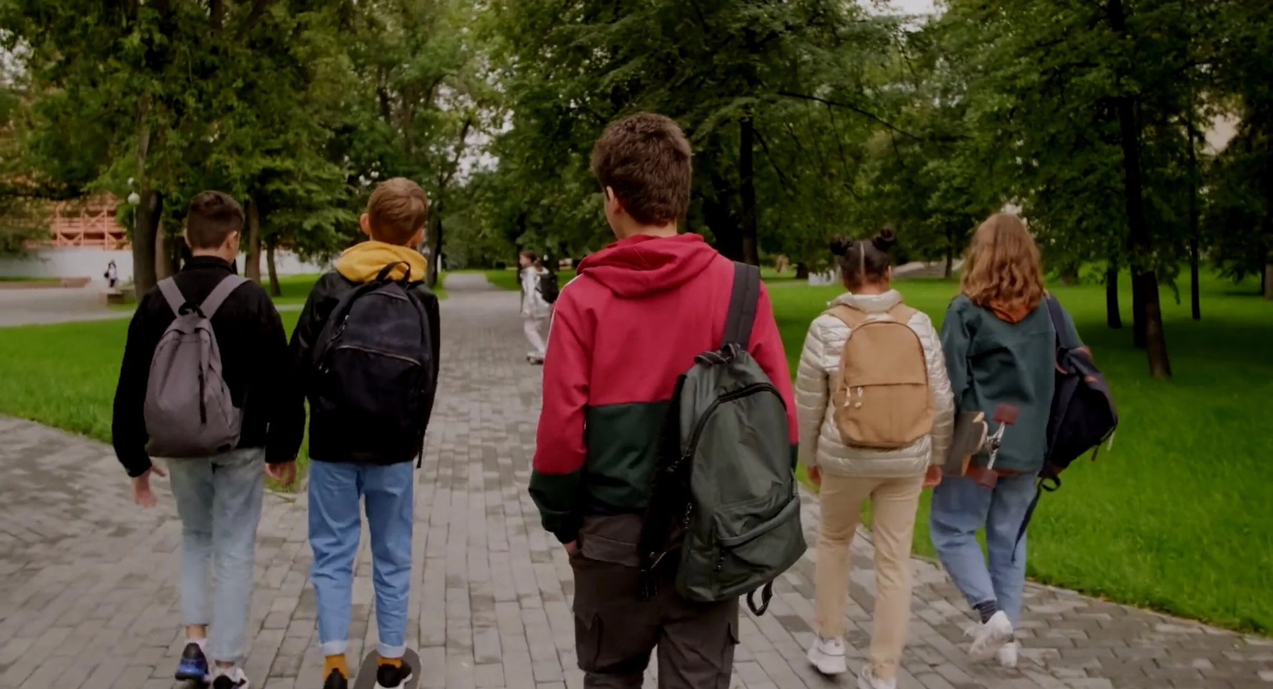 Young people walking together through a park