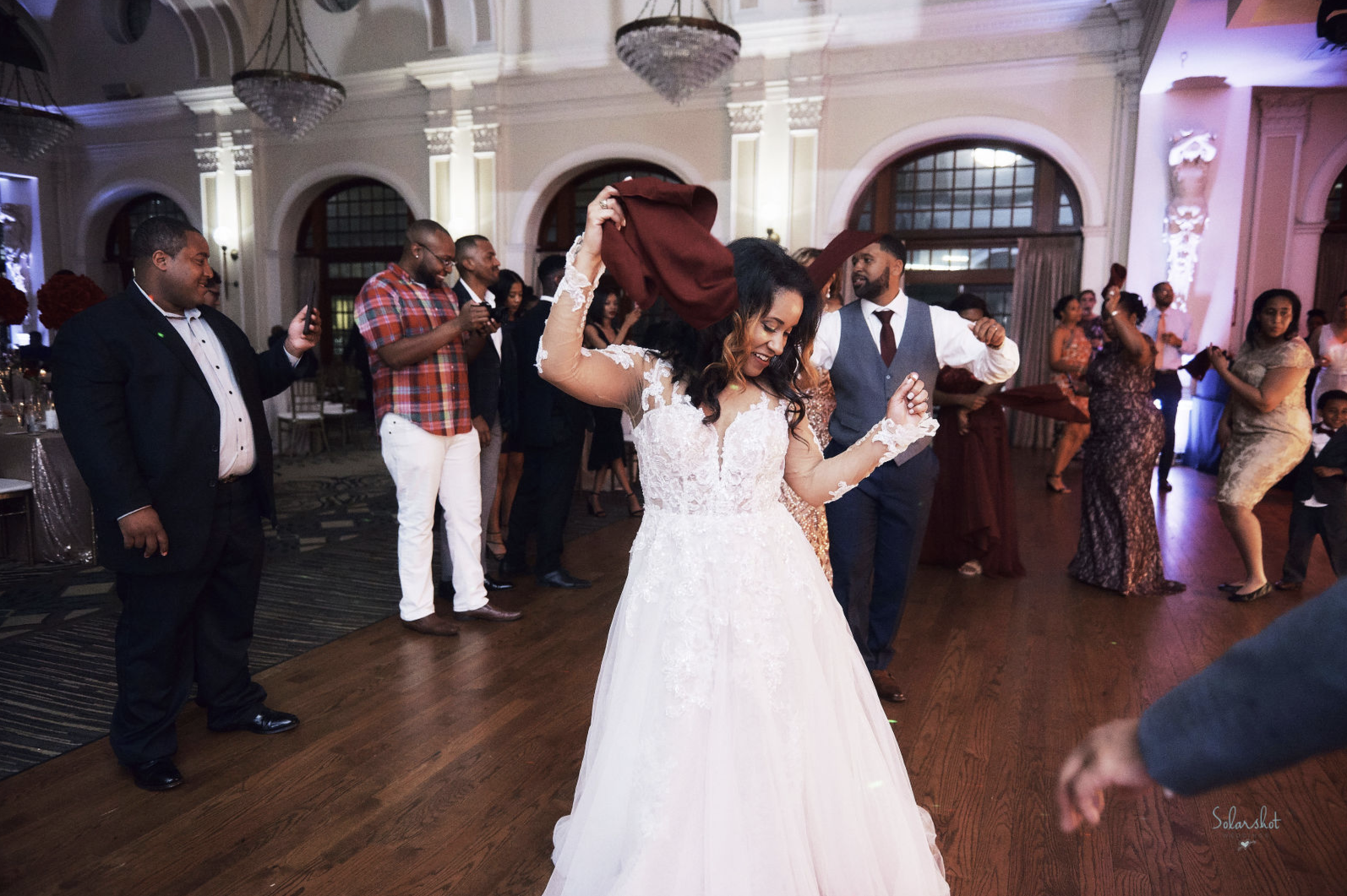 Bride dancing in a ballroom