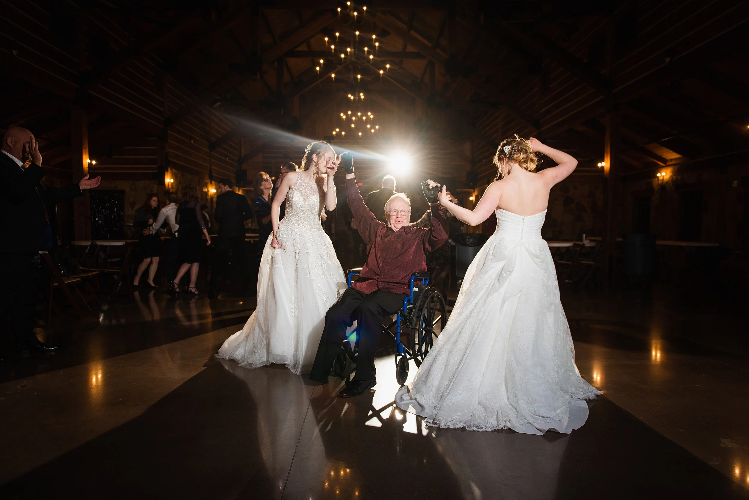 Both brides dance for the father daughter dance