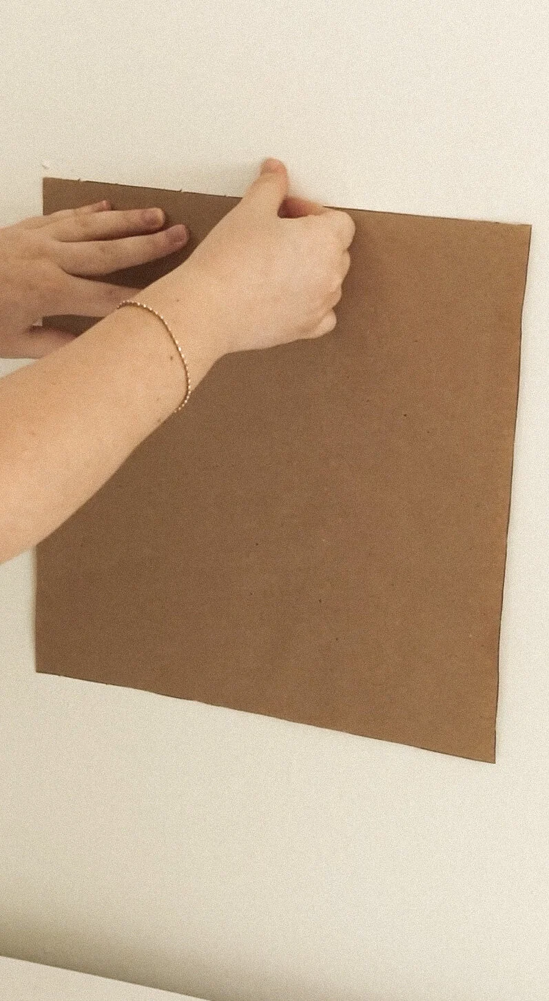 Step 5. Use a leveler to ensure your gallery wall is straight.