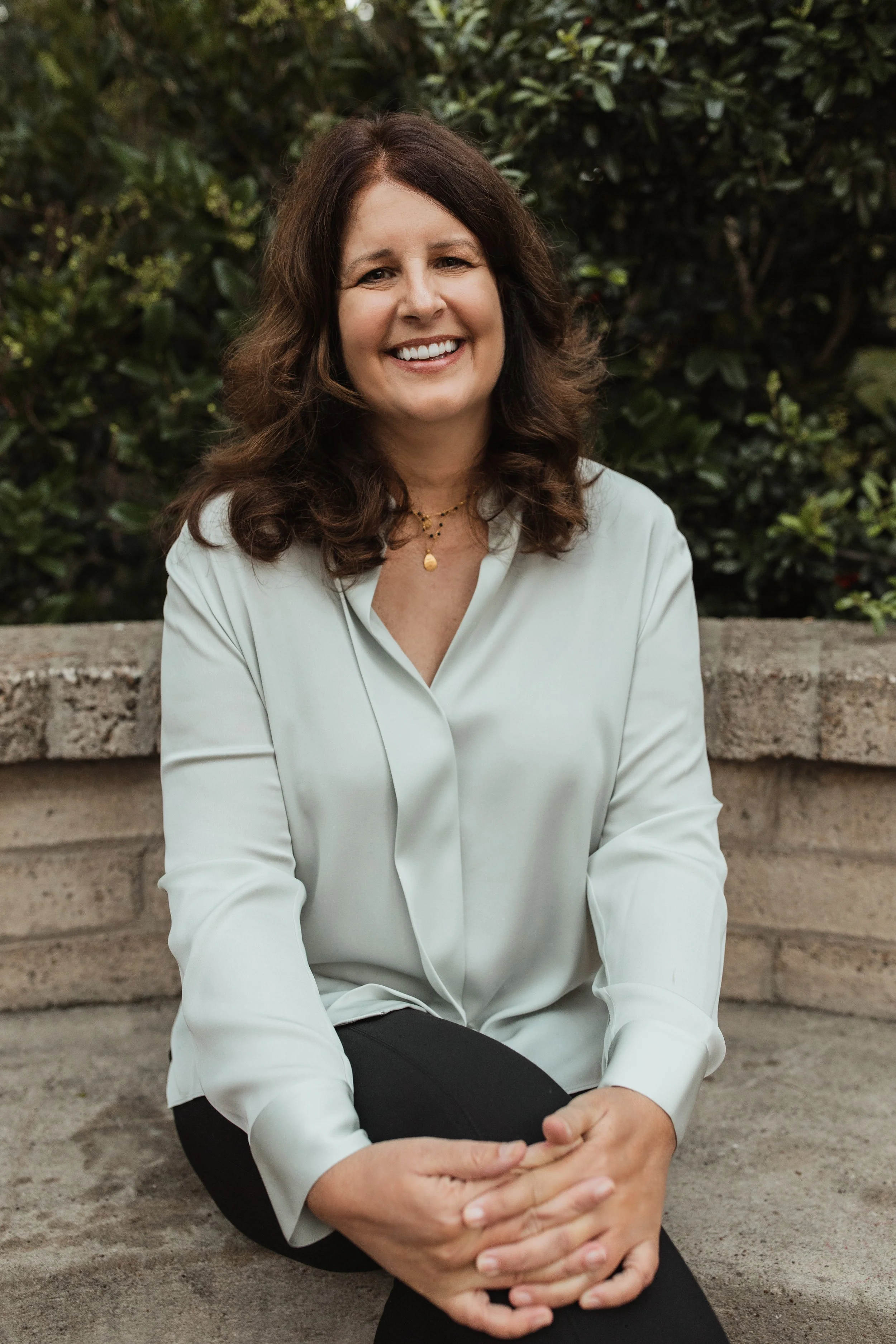 A  woman with long dark hair 