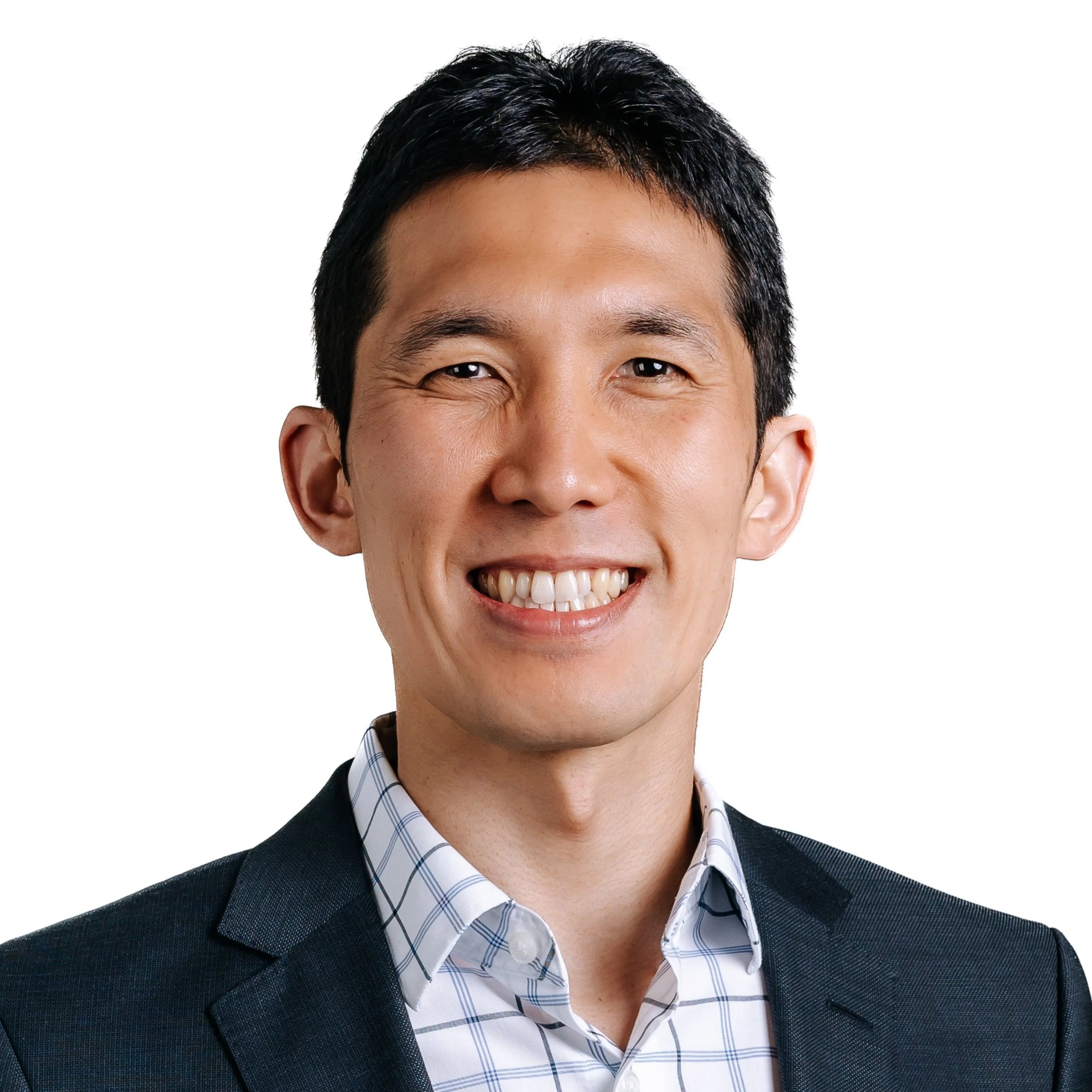 Professional headshot of a smiling Asian man wearing a dark suit and checkered shirt.