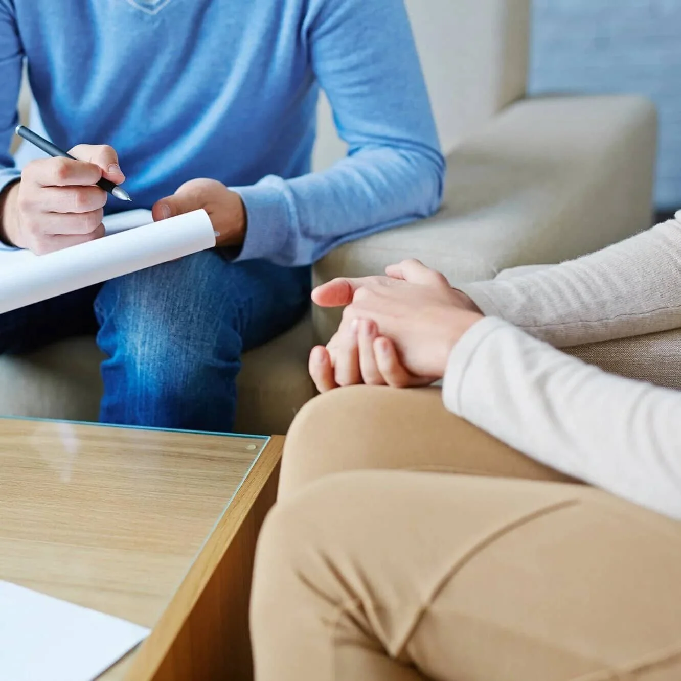 therapist with patient taking notes