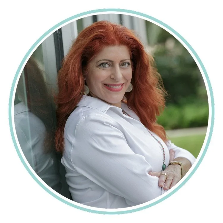 Portrait of therapist Alexa von Oertzen smiling with arms crossed, supporting emotional intelligence (EQ) and self-understanding in Coral Springs therapy.