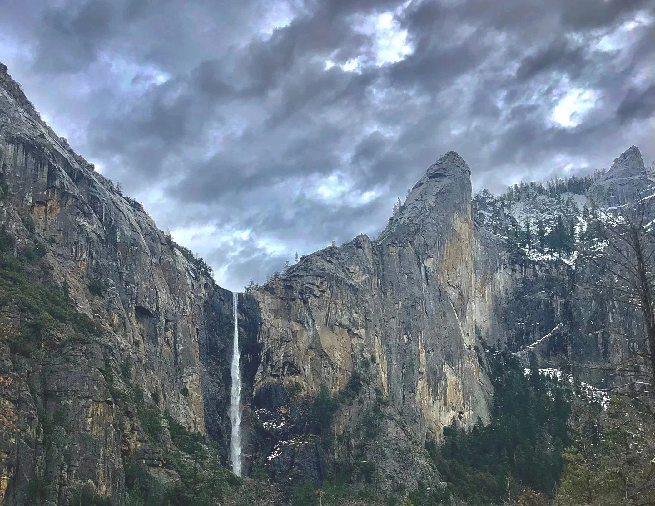 View of Bridalveil Fall in Yosemite National Park with stormy clouds