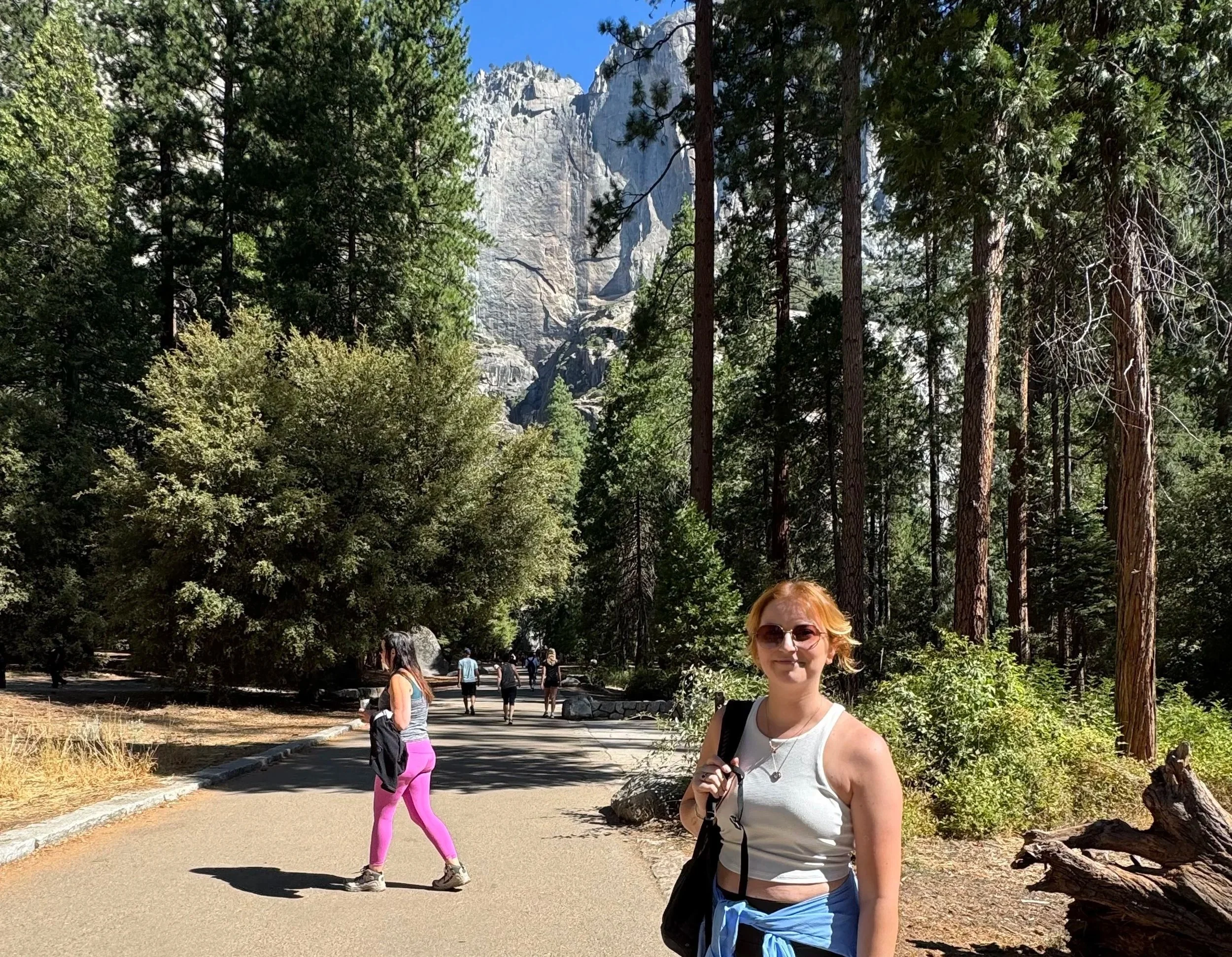 Young woman at trailhead of Yosemite Falls