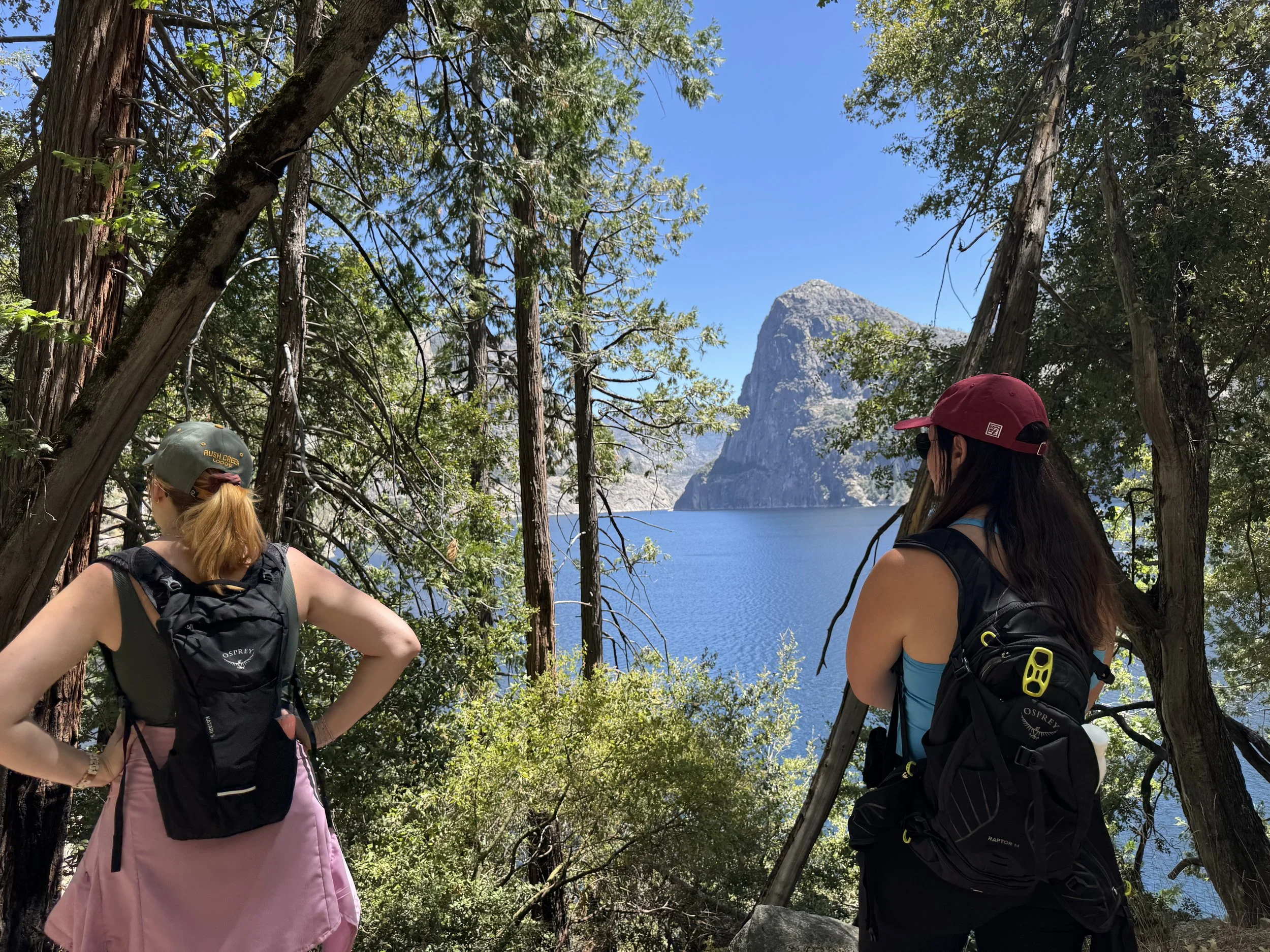 Young women looking at the water at Hetch Hetchy Reservoir in Yosemite National Park