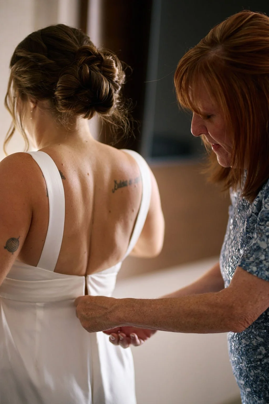 bride getting ready with mom