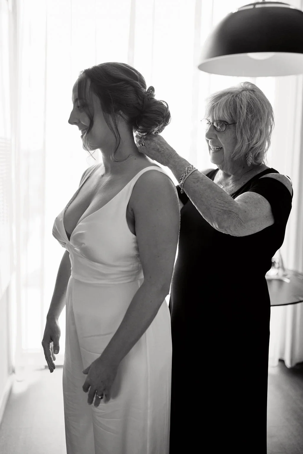 bride getting ready with mom