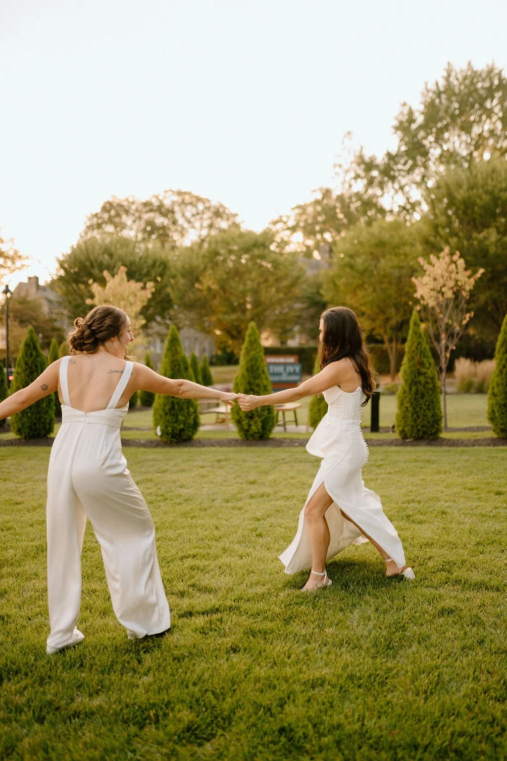 playful lgbtq wedding couple outdoors