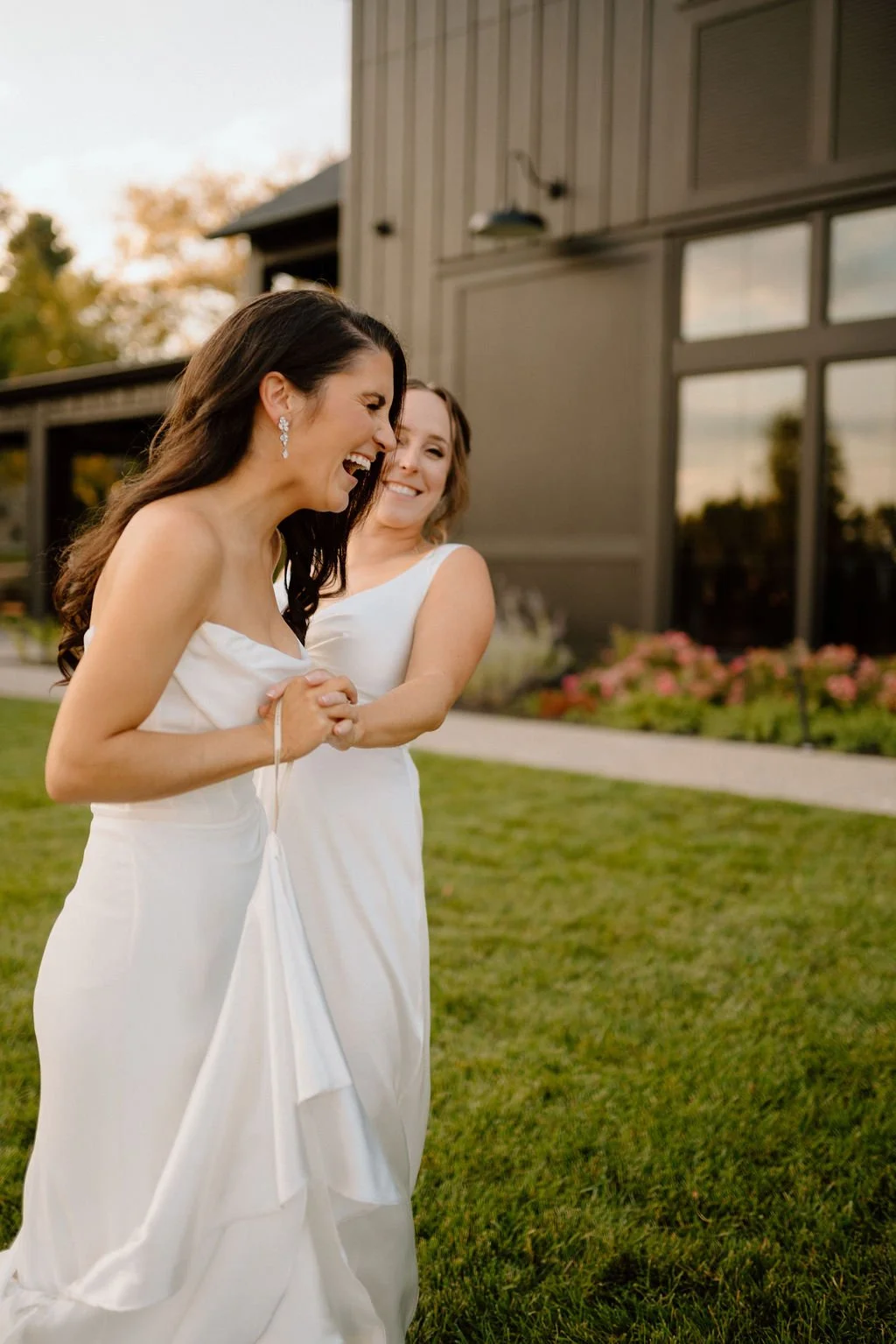 playful lgbtq wedding couple outdoors