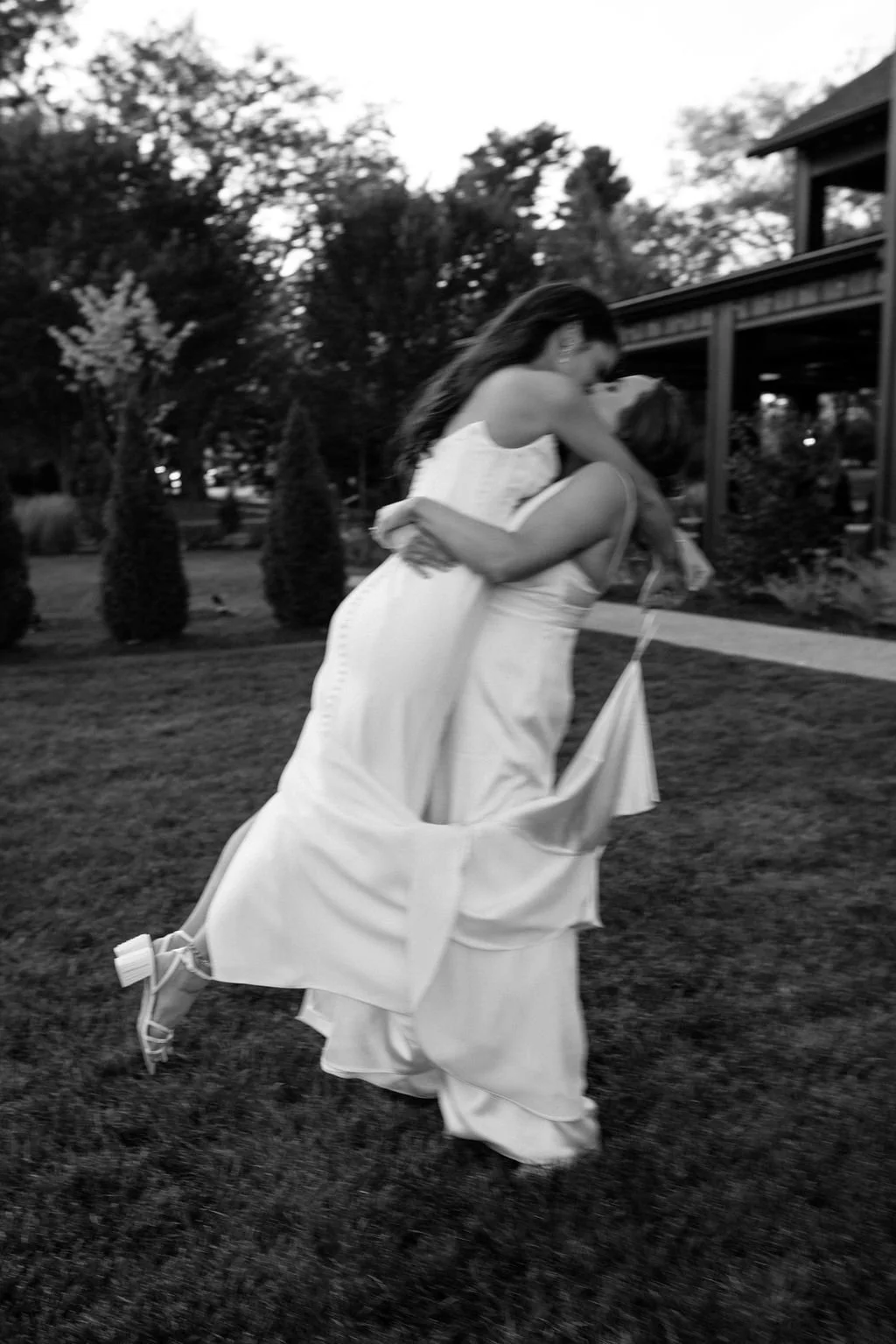 playful lgbtq wedding couple outdoors