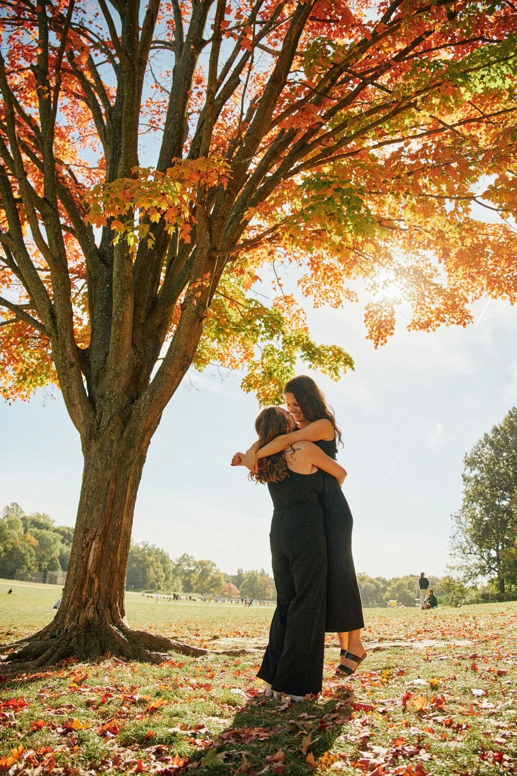 candid queer engagement photos at prospect park in brooklyn