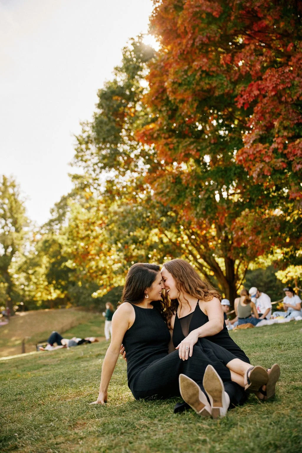 candid queer engagement photos at prospect park in brooklyn