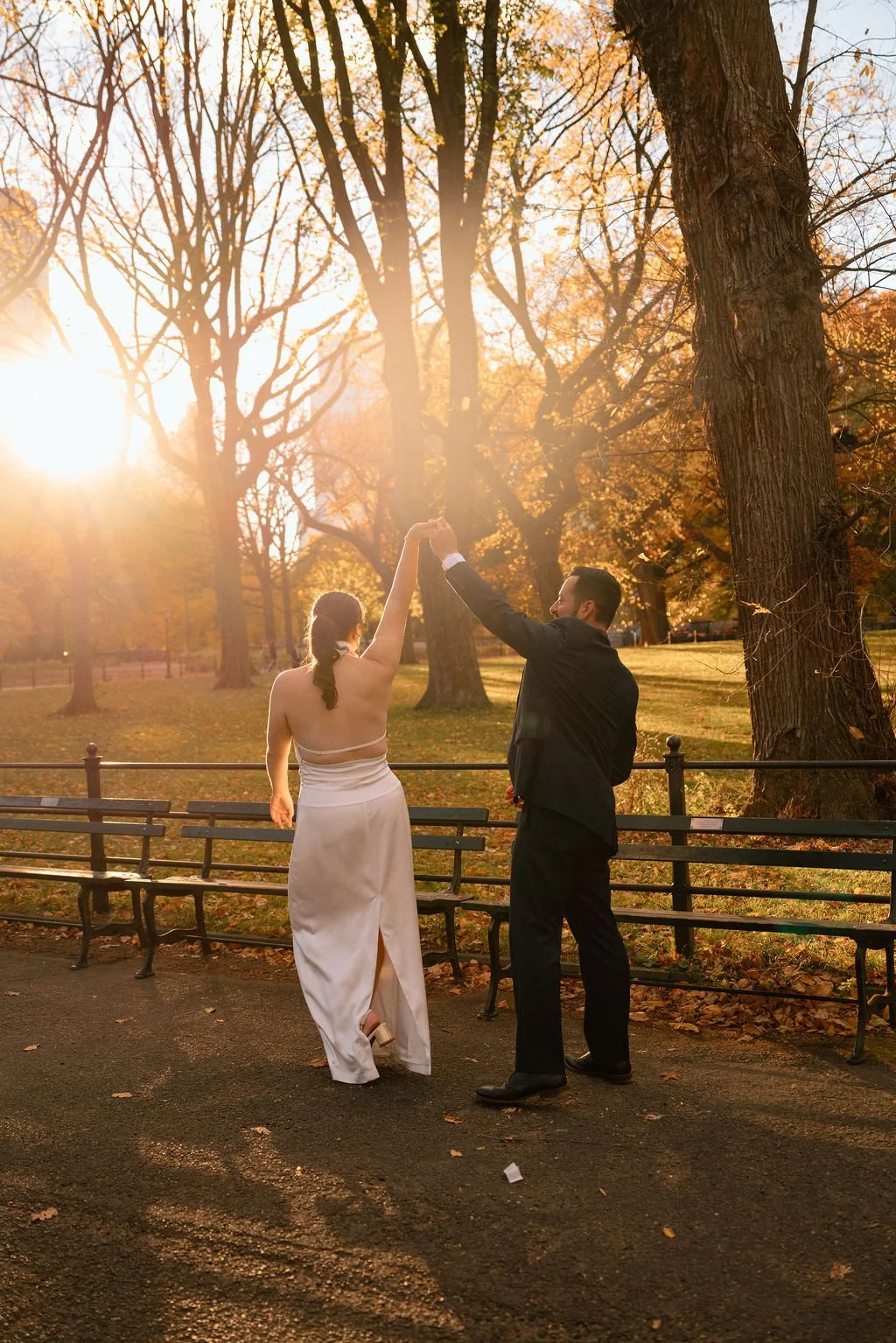 sweet couple dancing during their central park elopement during fall