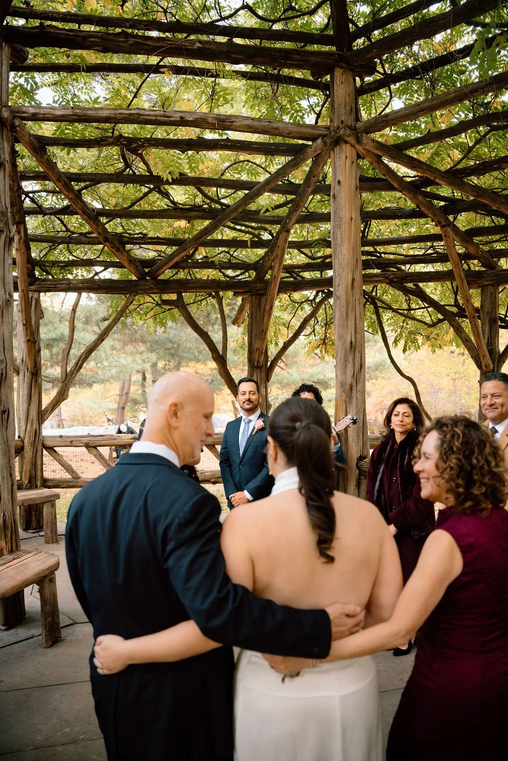 parents walking bride down the aisle for the cop cot elopement ceremony in central park
