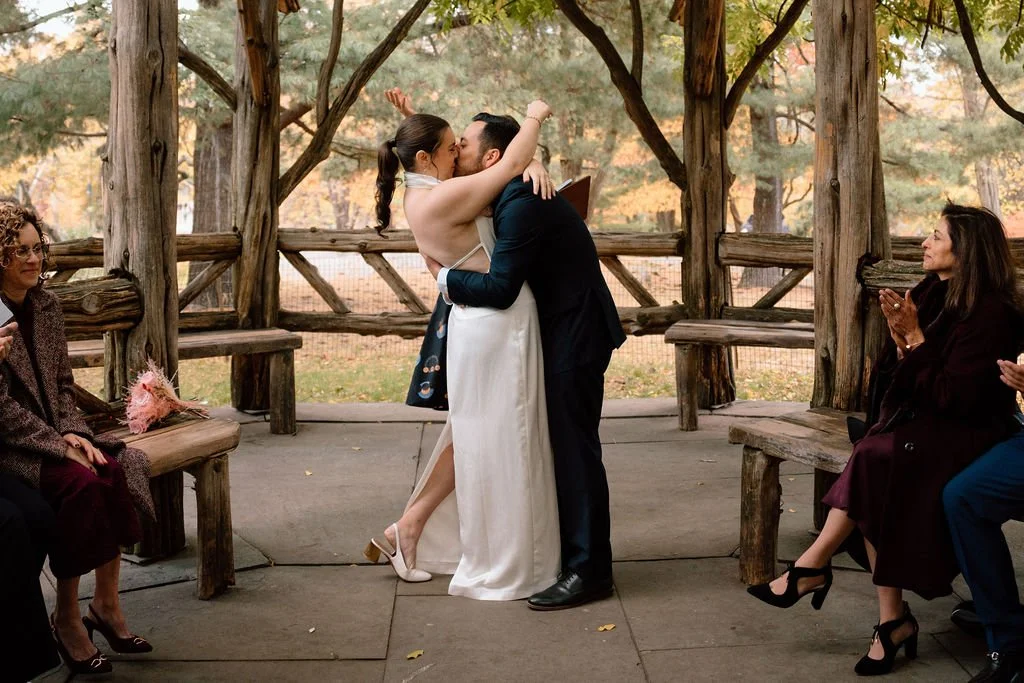 bride and groom during their cop cot elopement ceremony in central park