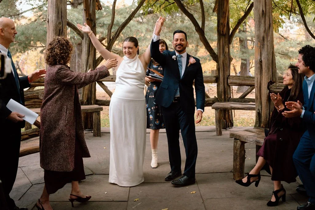 bride and groom during their cop cot elopement ceremony in central park