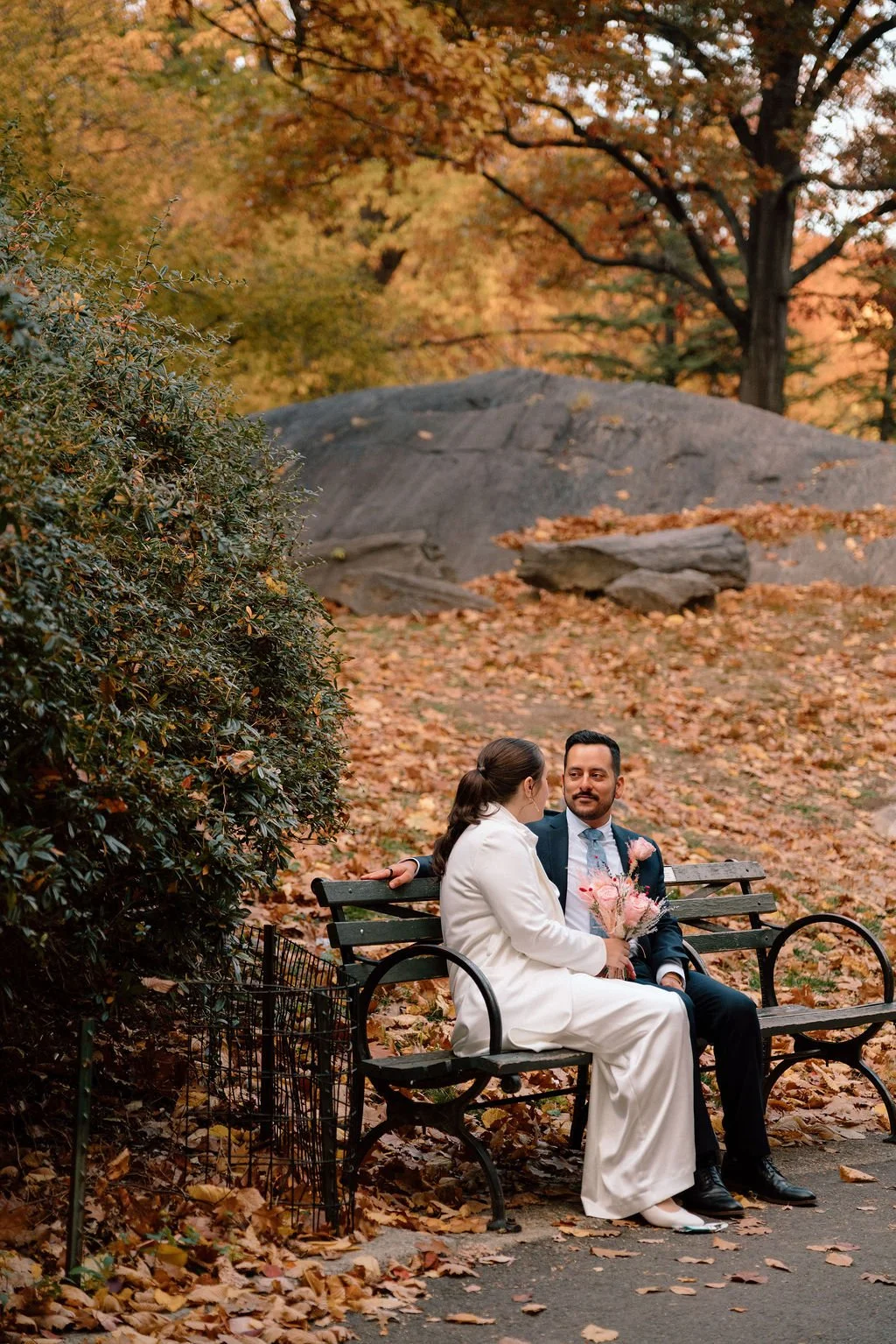 romantic elopement couple moments in central park surrounded by fall foliage
