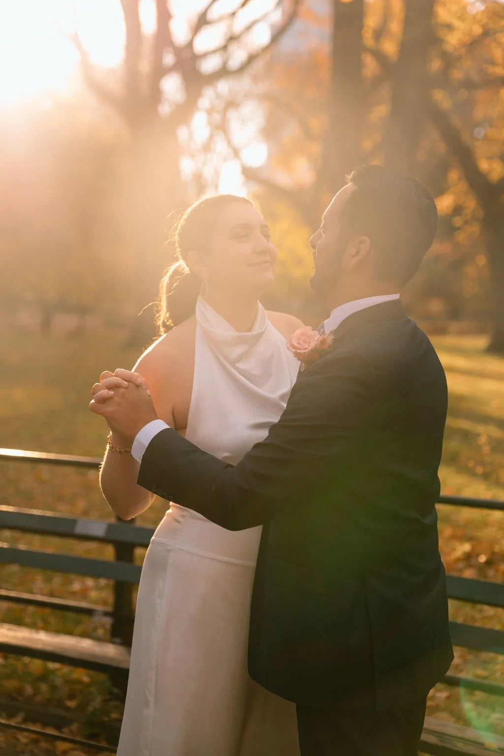 romantic elopement couple moments in central park surrounded by fall foliage