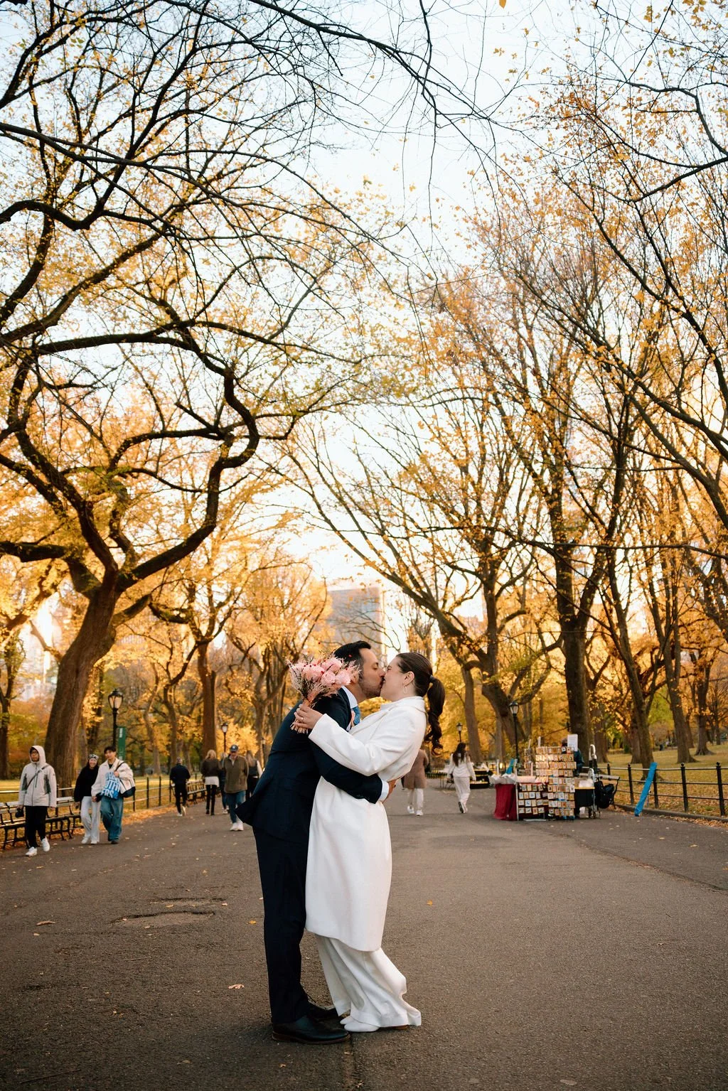 romantic elopement couple moments in central park surrounded by fall foliage