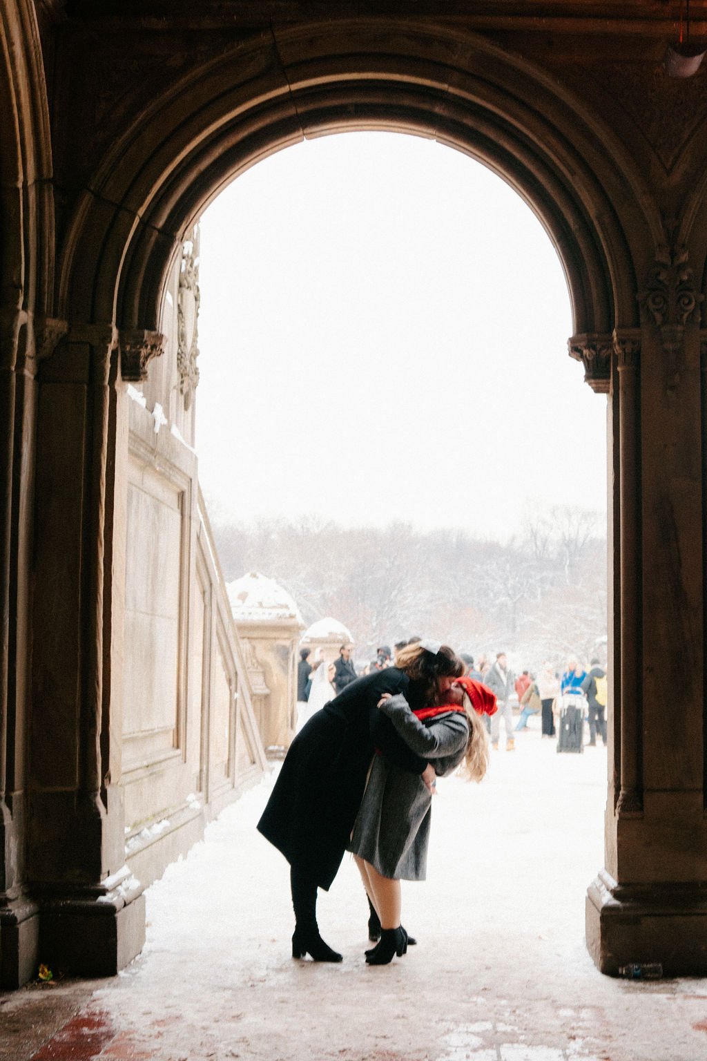 Snowy Lesbian Central Park Engagement Session at Bethesda Terrace