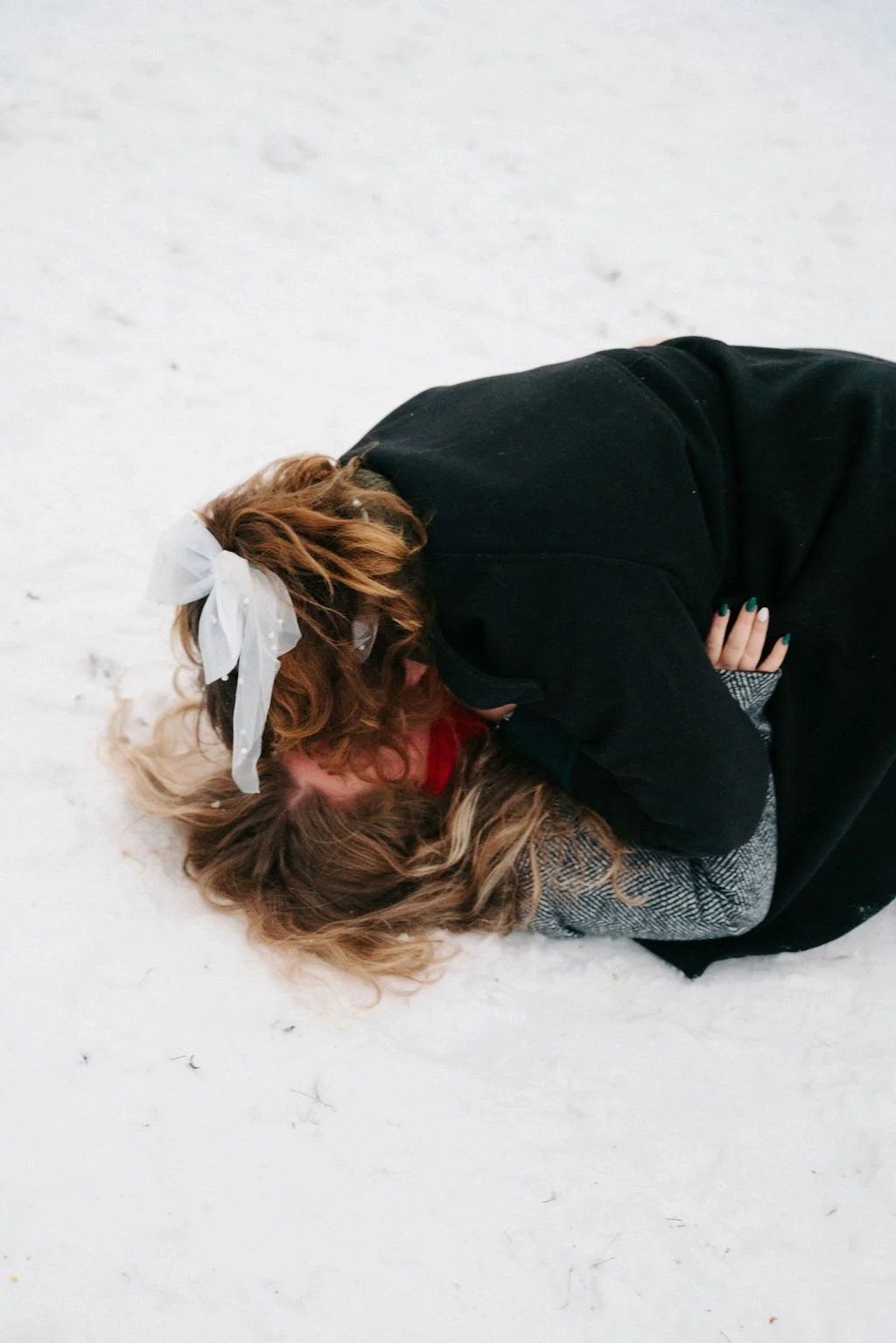 playful lesbian engagement photos in the snow at central park