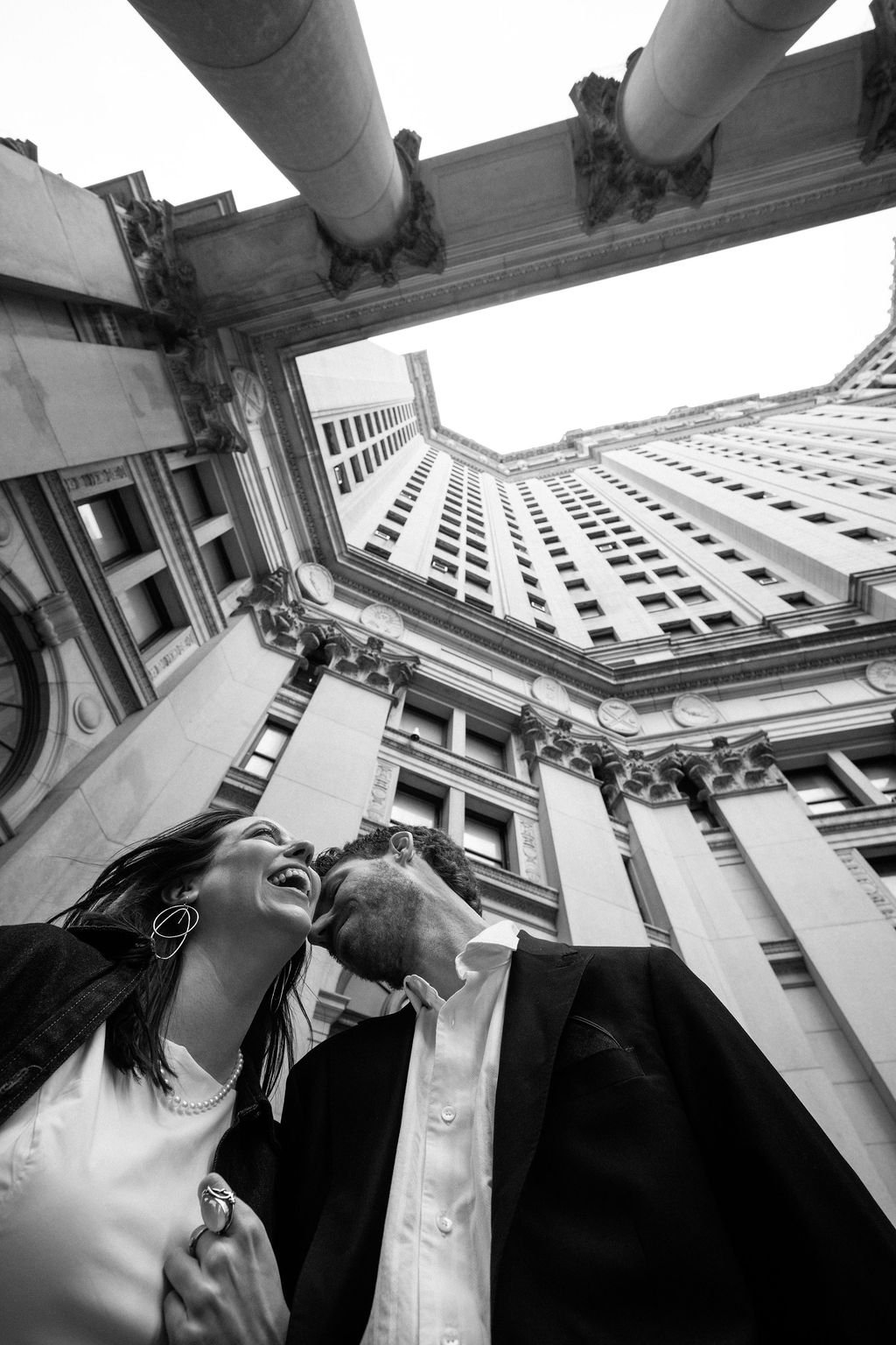 Bride and groom walking through Lower Manhattan following their NYC City Hall wedding