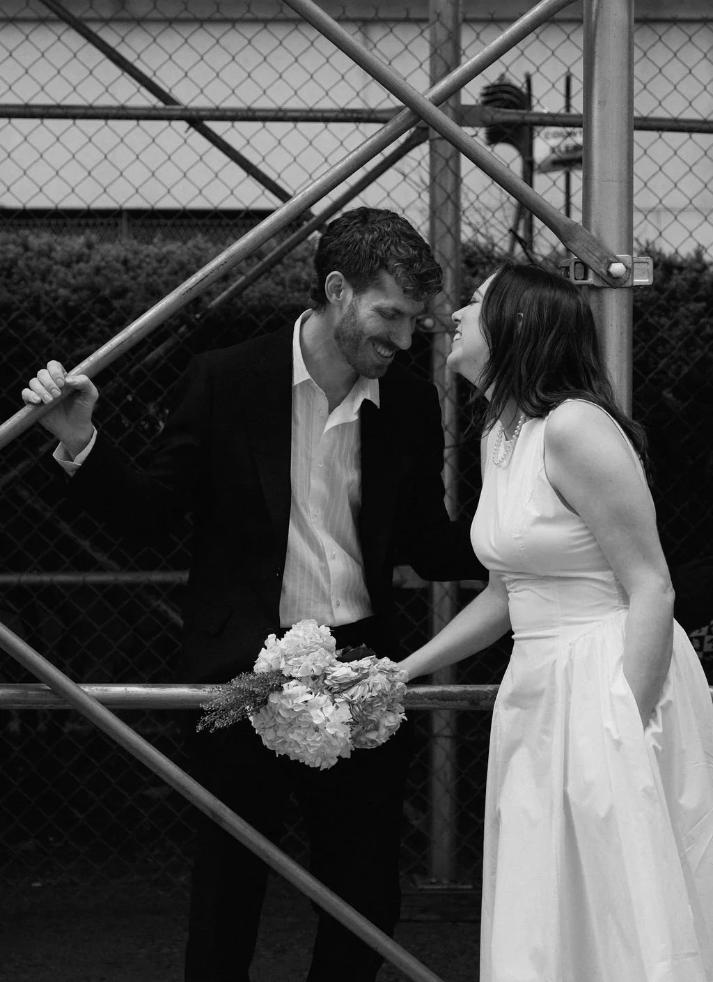 Bride and groom riding the New York City subway after their intimate wedding
