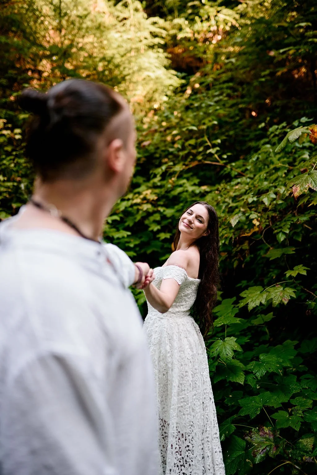 wedding couple roaming around in quinault rainforest
