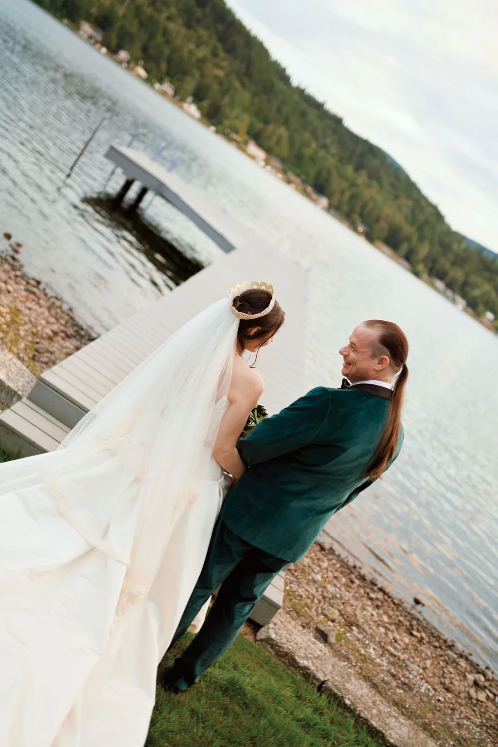 bride and groom on the lake dock during their olympia wa wedding day