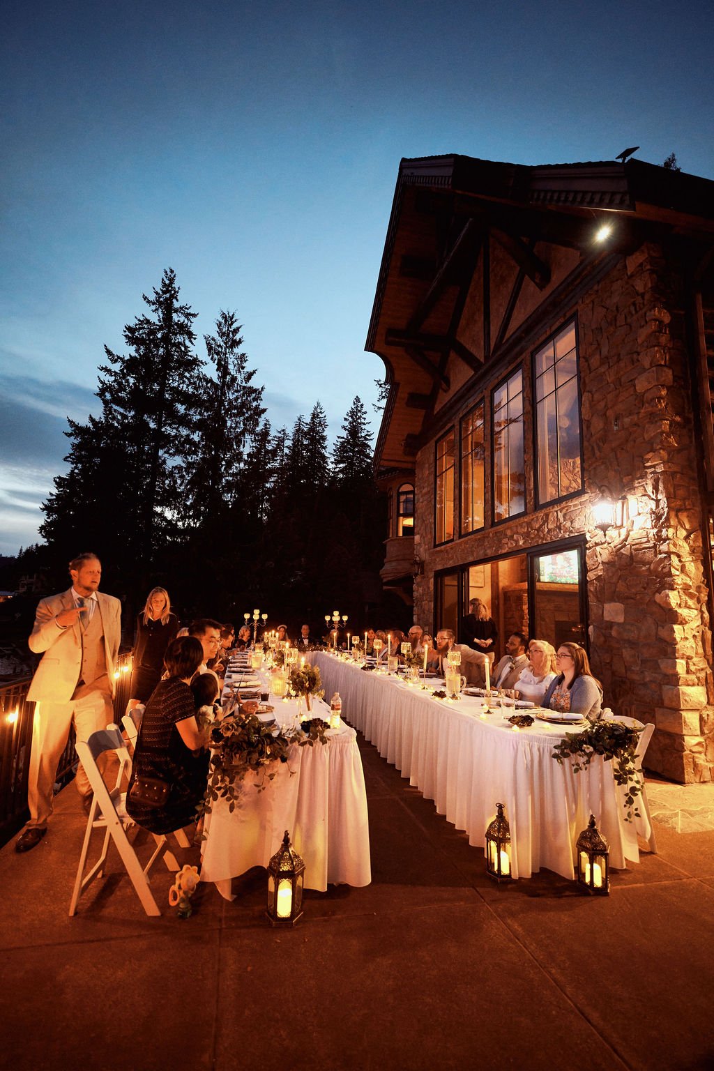 The Castle at Summit Lake outdoor wedding reception set up during late evening