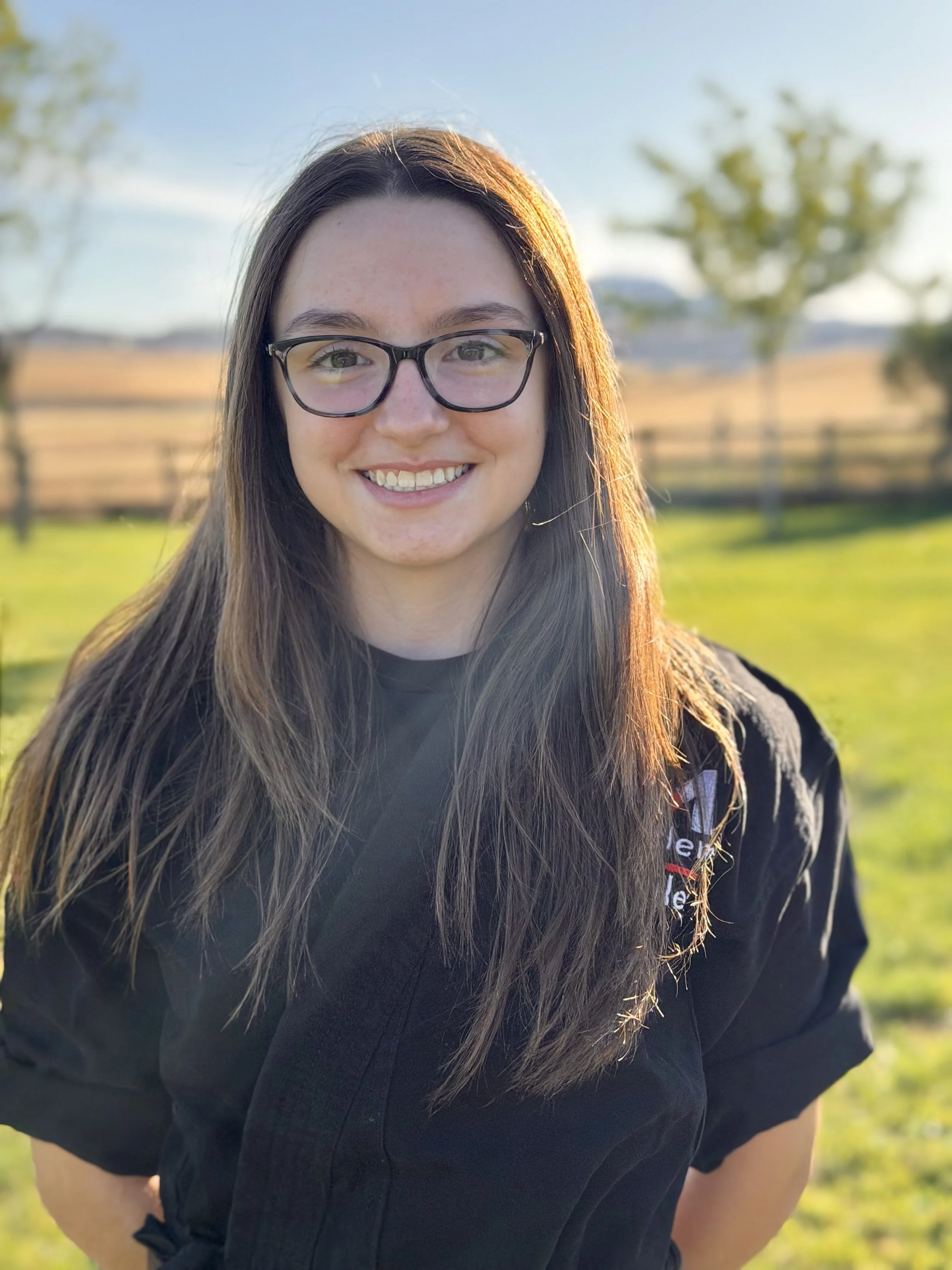 woman smiling in a field
