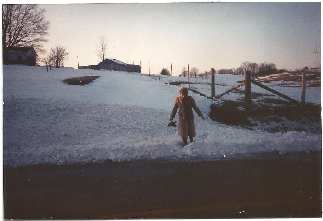 Lydia walking from the Bulls Gap farm house in deep snow