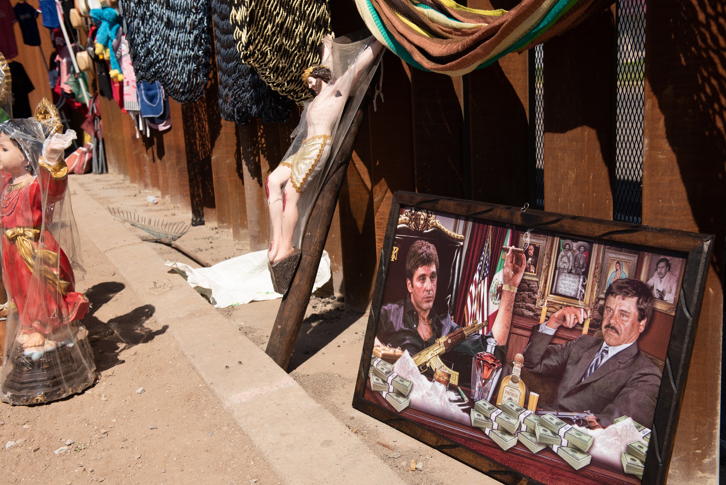 A vendor’s collection of items for sale along the border wall