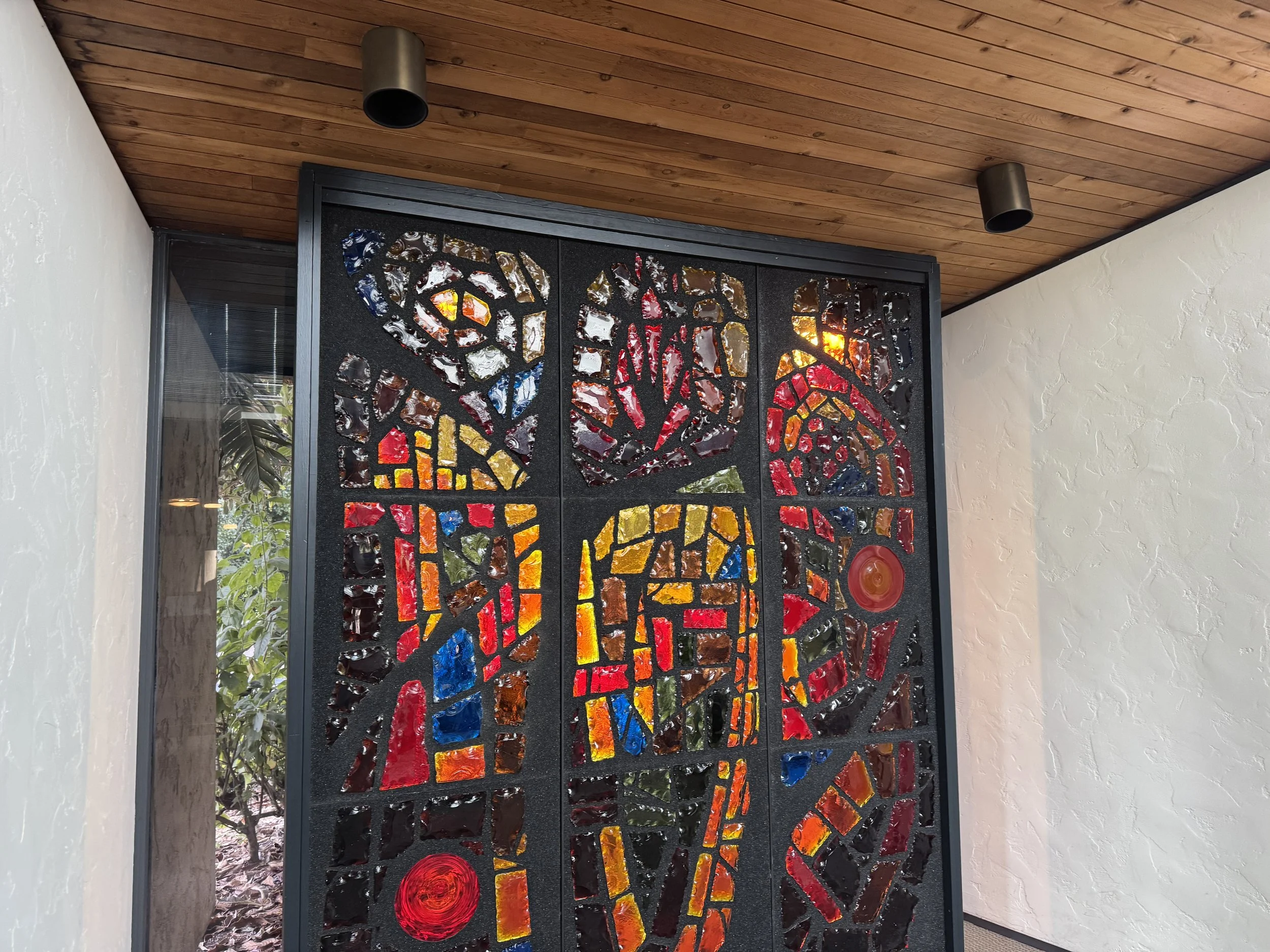 The distinct aesthetic of this sanctuary might be best seen in this large stained glass piece at the rear of their chancel. It is stunning. 

And during certain parts of the day, the setting sun illuminates it. Other parts of the day, it is less maje