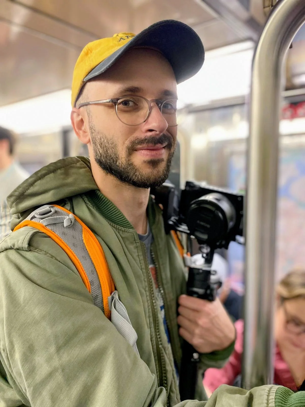 Photo of Alec Hutson, founder of Warbird Creative, holding a camera on a gimbal