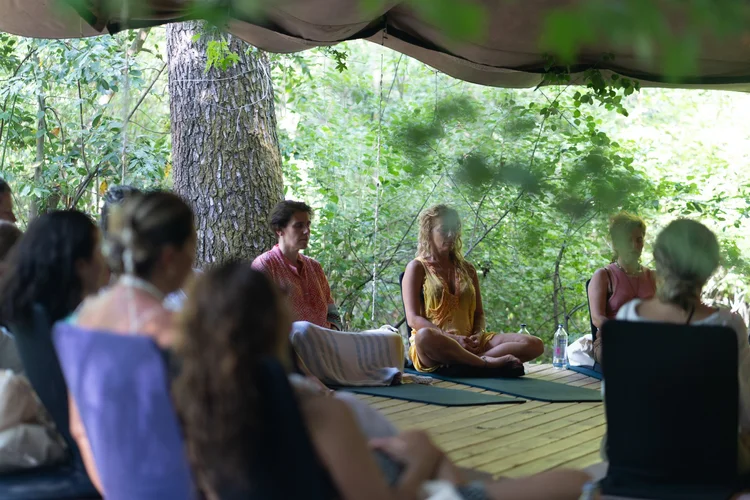 A group sitting in meditation
