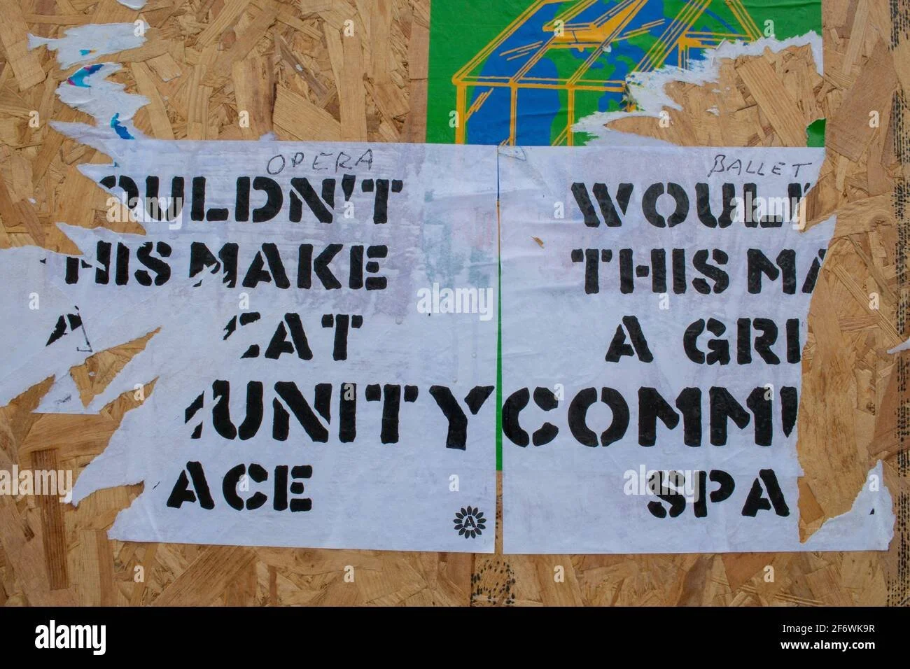 a-torn-poster-suggesting-that-this-could-be-a-community-space-and-not-another-supermarket-is-stuck-to-a-temporary-construction-site-plywood-wall-2F6WK9R.jpg