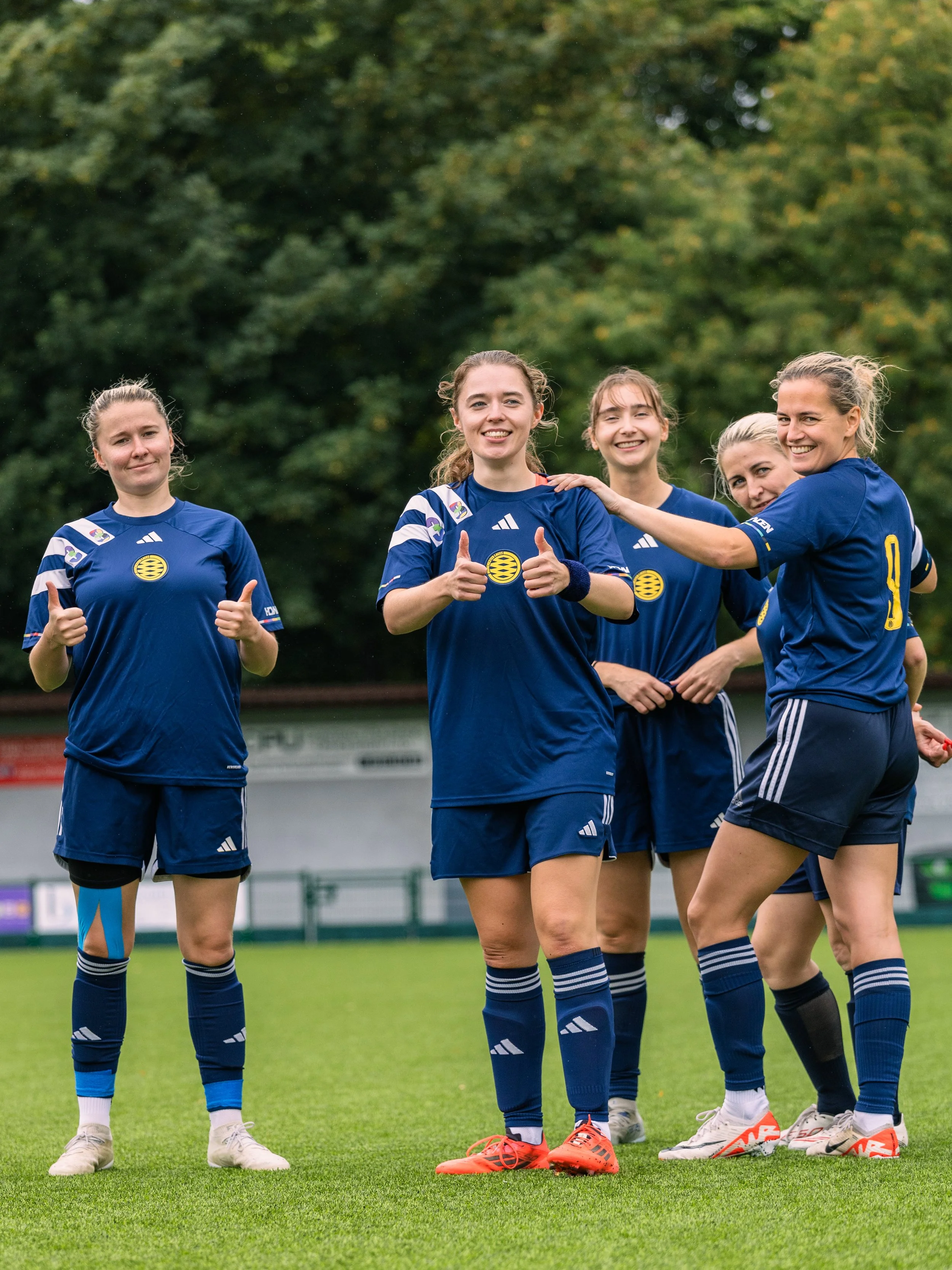 A group of 4 women smiling for a team photo