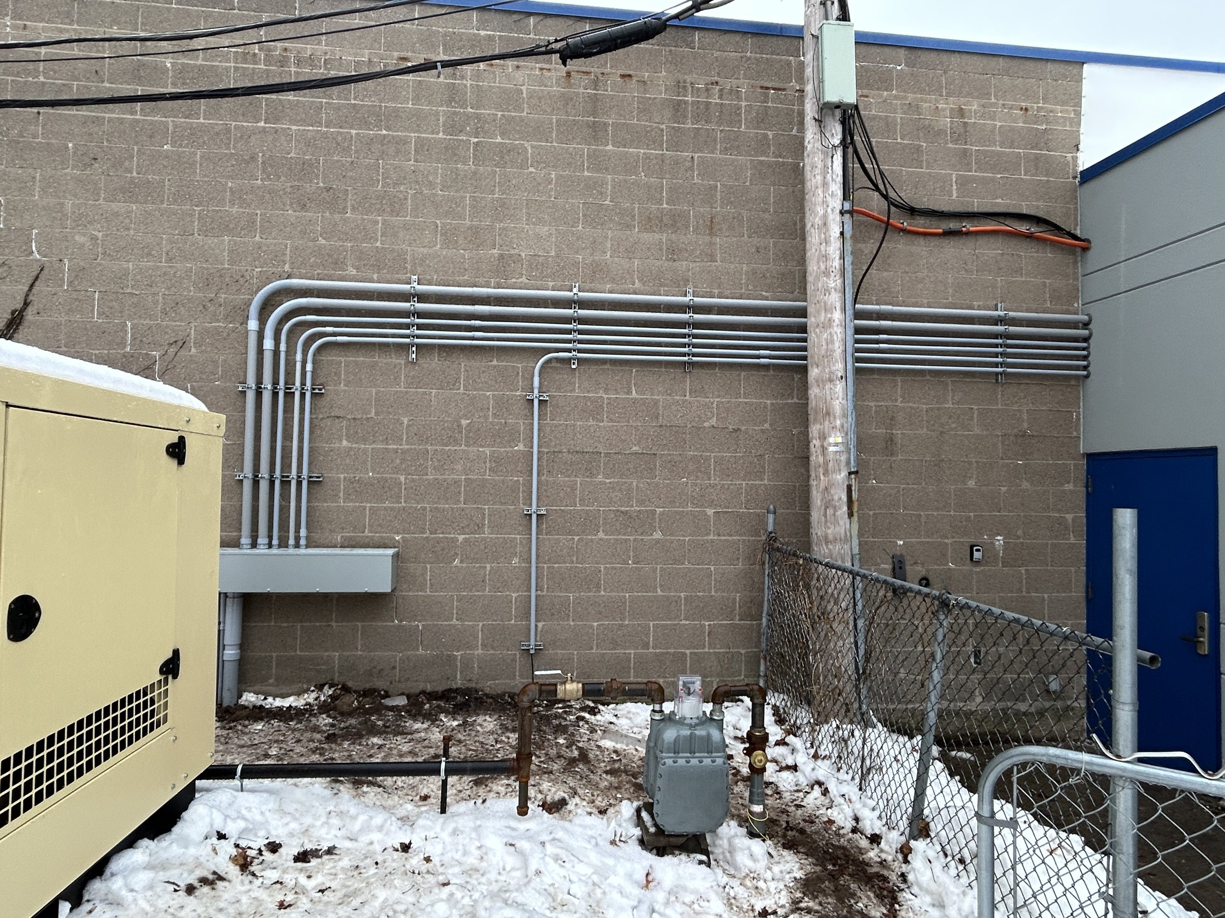 Conduit installed by the licensed electricians at Tri-Star Electric for a generator at a commercial building in Rochester, New York.