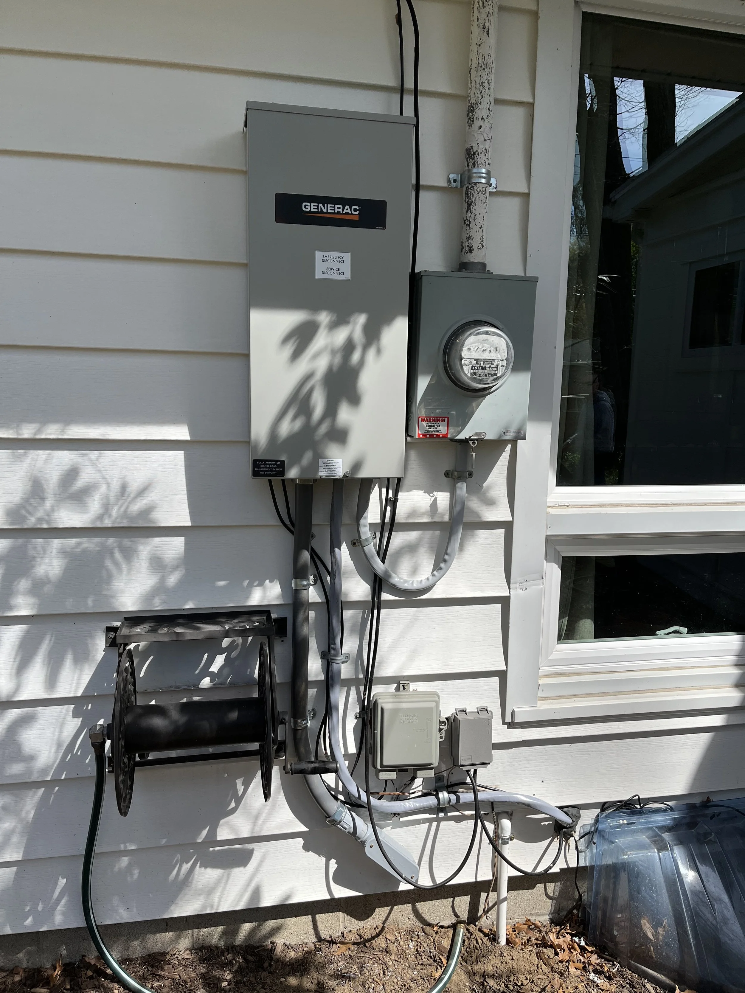 A Generac automatic transfer switch installed by the licensed electricians at Tri-Star Electric in Pittsford, New York.