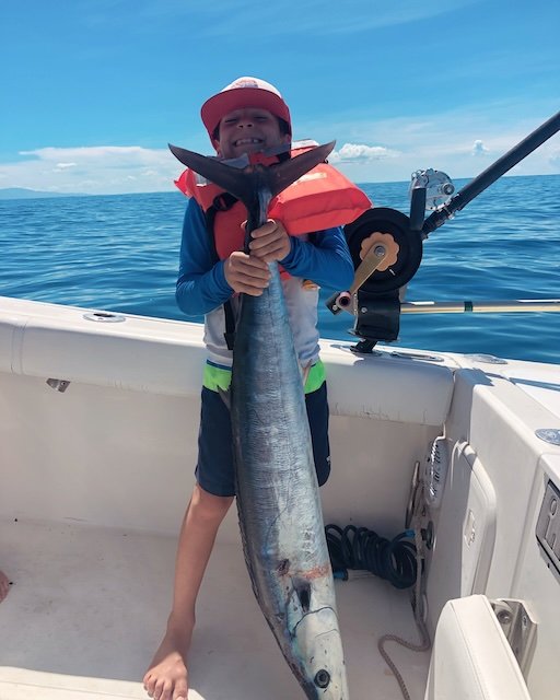 take a kid fishing in Puerto Rico.  Nice Wahoo